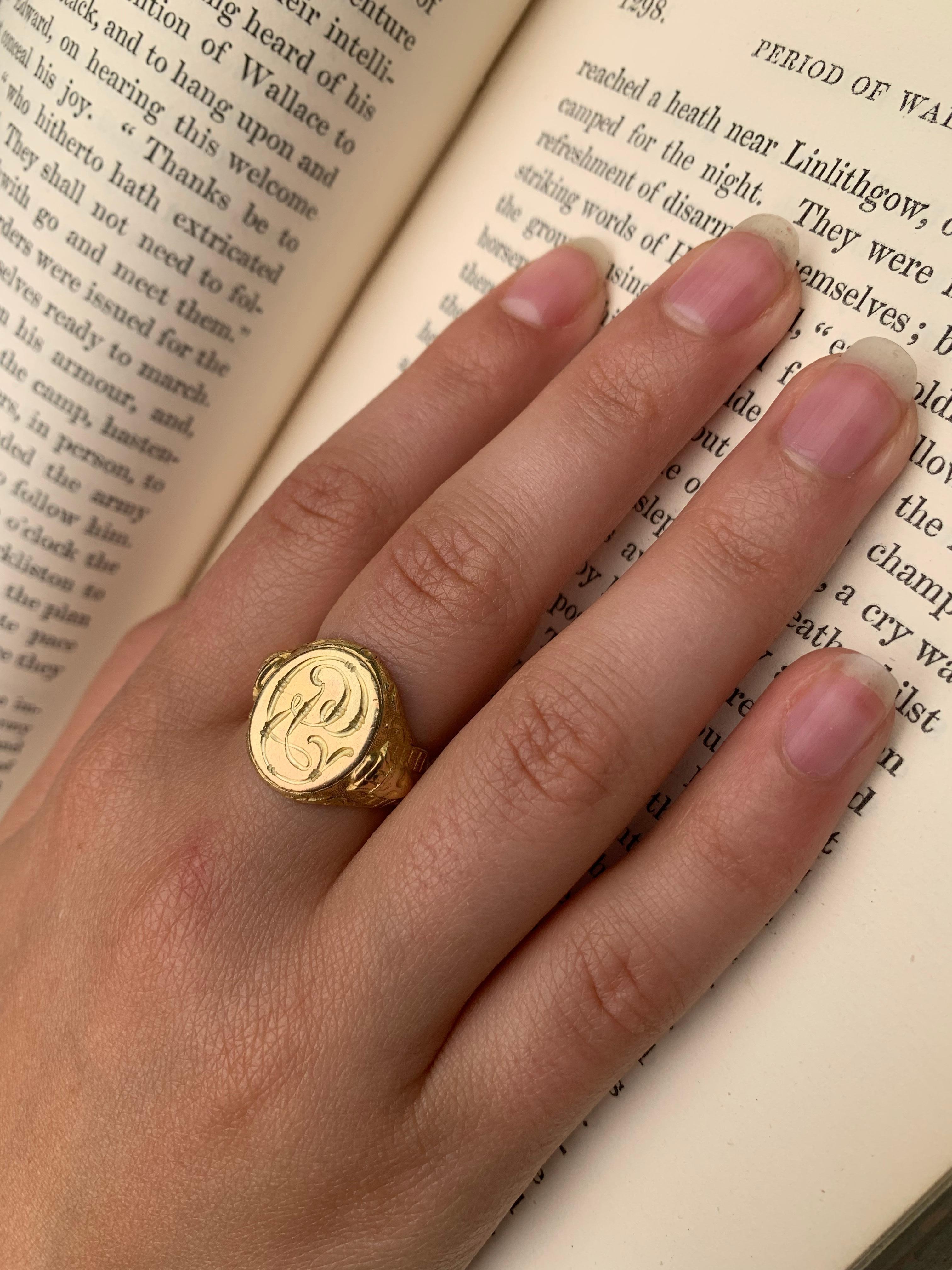 19th Century Egyptian Revival period 14K yellow gold Sphinx signet ring 
Circa 1870
Unusual, beautifully detailed antique signet ring with a pair of Sphinxes at the shoulders, each flanked by a lizard and a pair of storks. The oval signet face