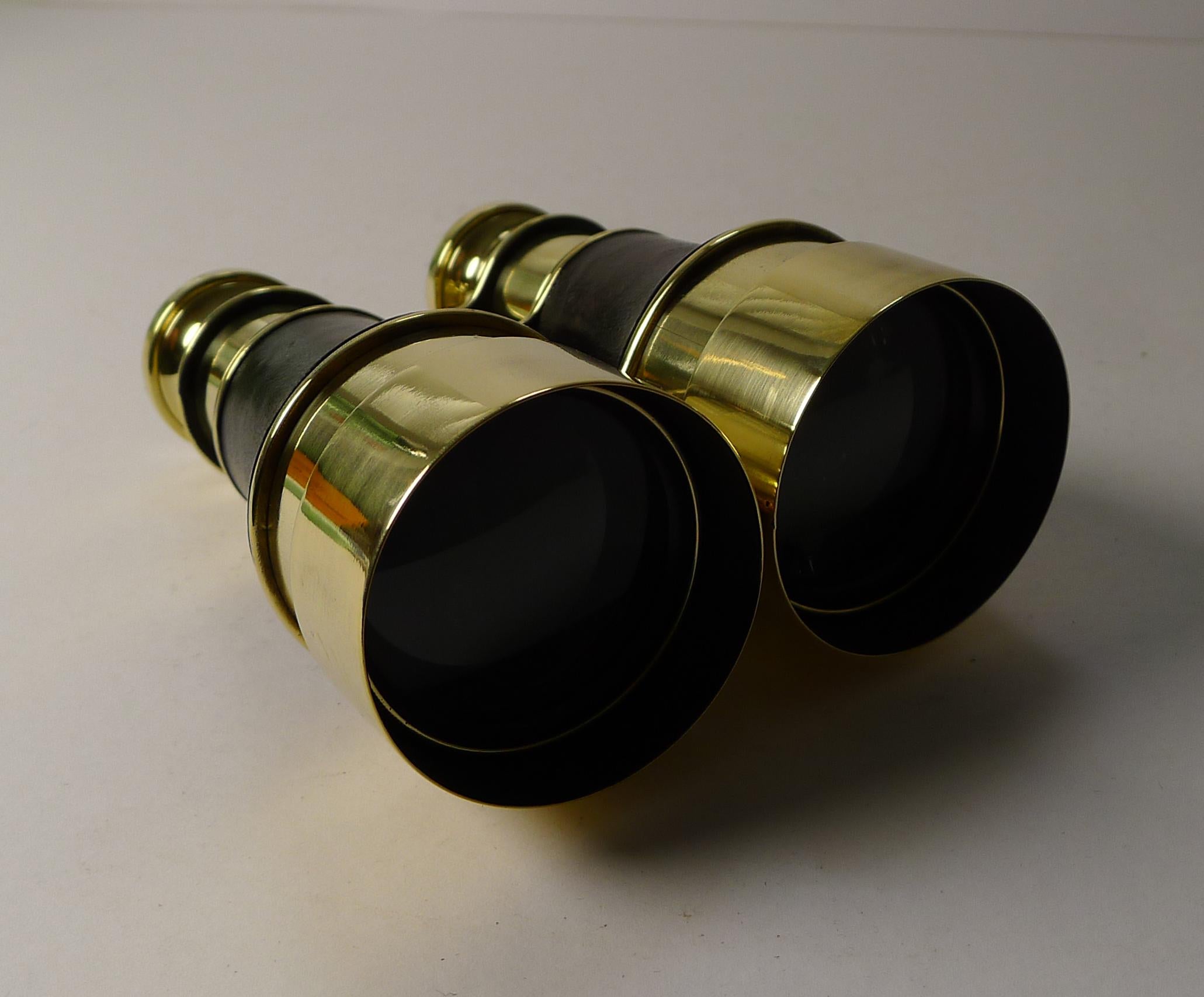 A particularly fine pair of antique English binoculars, a pair we have not come across before. The brass eye pieces are engraved with the makers 