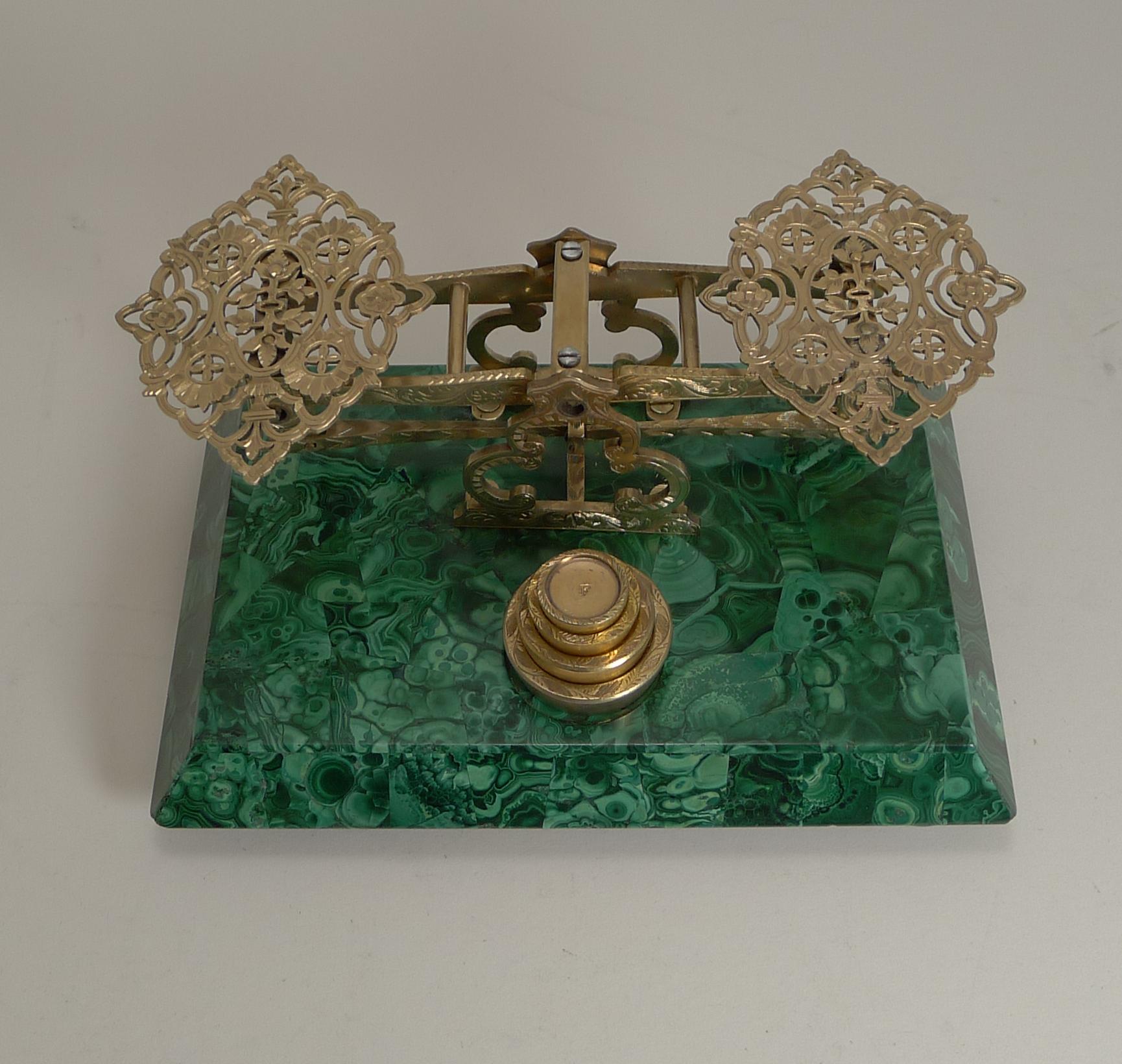 A very fine and rare antique English desk or letter scale, the base covered in stunning green Malachite.

The gilded brass or bronze fittings are all hand engraved and the two pans beautifully pierced or reticulated, top quality and quite