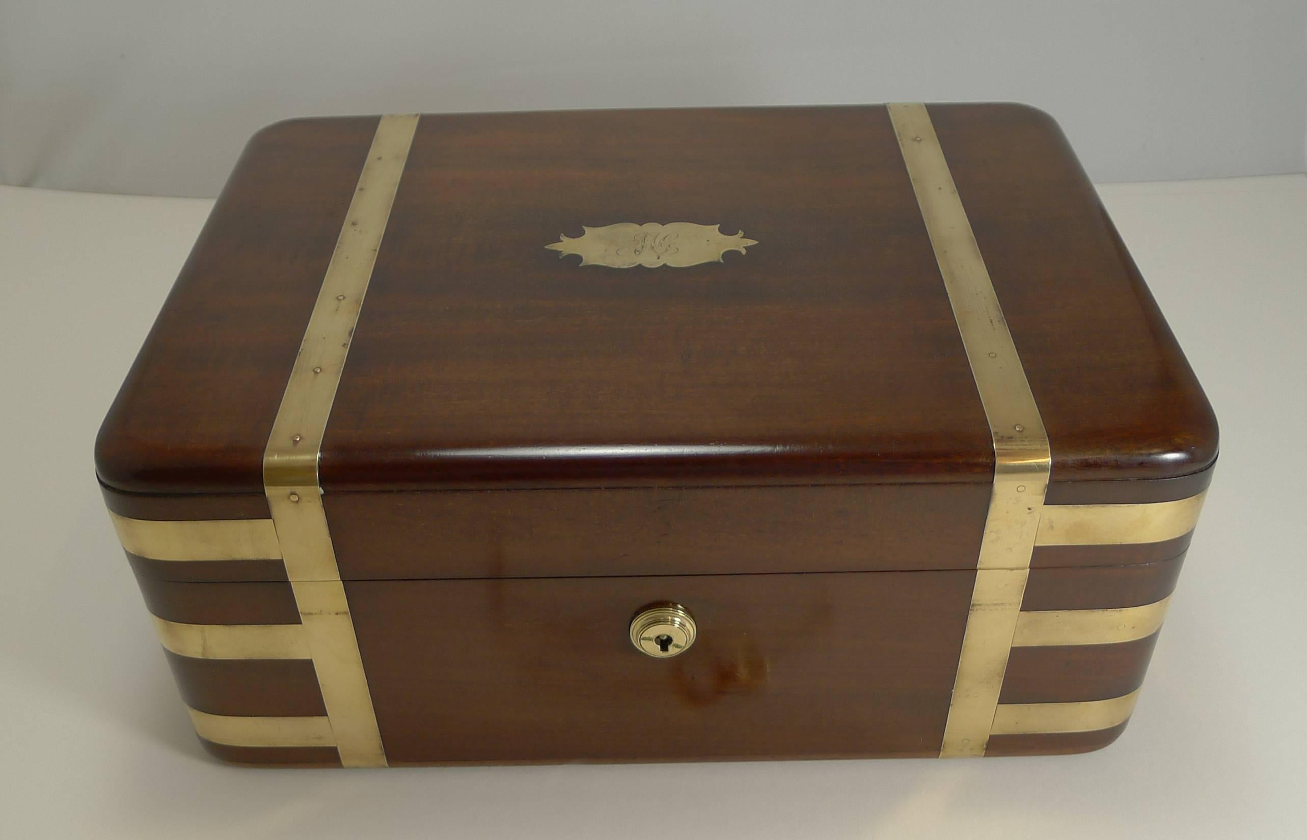 A great early 19th century brass bound campaign box made from a very hefty piece of solid mahogany. This top-notch example box is beautifully brass bound and has a pair of flush inlaid brass military style handles to the sides.

The box is