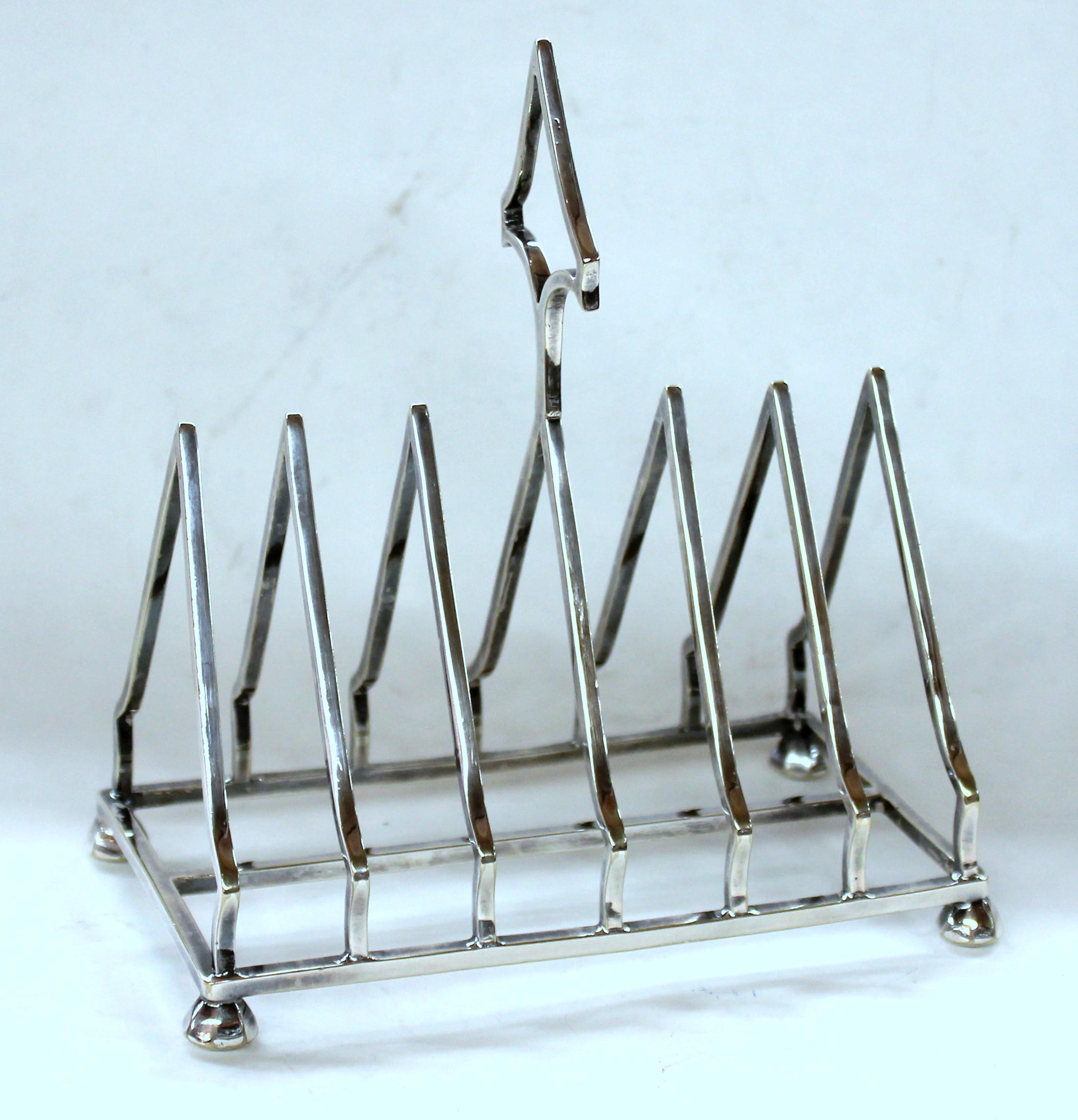 Superb quality silver plate seven-bar triangular shape letter rack
Makers Marks for Royal Warranted Silversmiths, Mappin and Webb (Prince's Plate)
-Sheffield and London-.