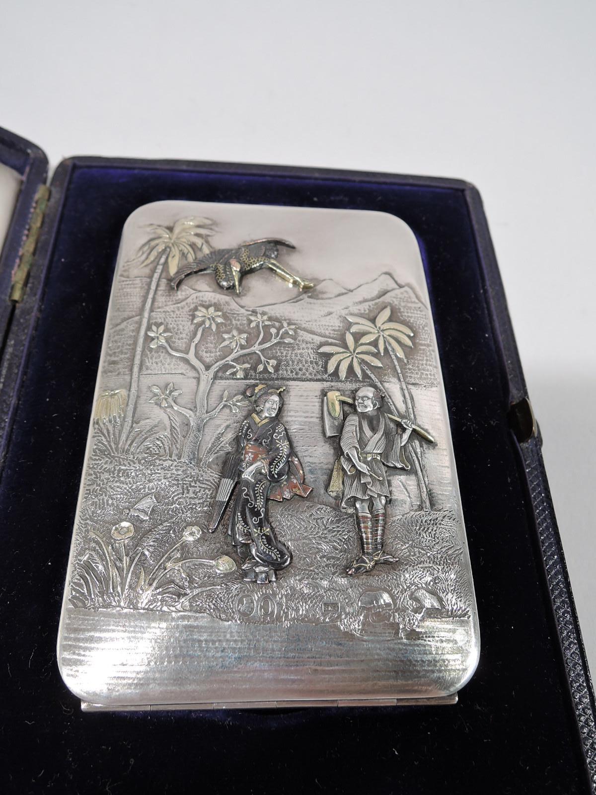 Victorian sterling silver and mixed metal dance card case. Made by Edward H. Stockwell in London in 1878. Rectangular and hinged with wonderful period ornament Applied silver and gold figures including a kimono-clad geisha carrying a parasol,