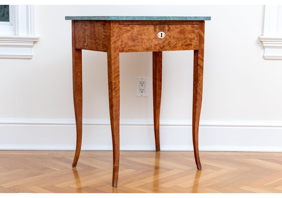 A fabulous little accent table the perfect size for a variety of uses, well crafted with great Louis XV style. The table features a shapely duck egg blue stone top with flared front corners overhanging an eye-catching figured maple frame in a rich