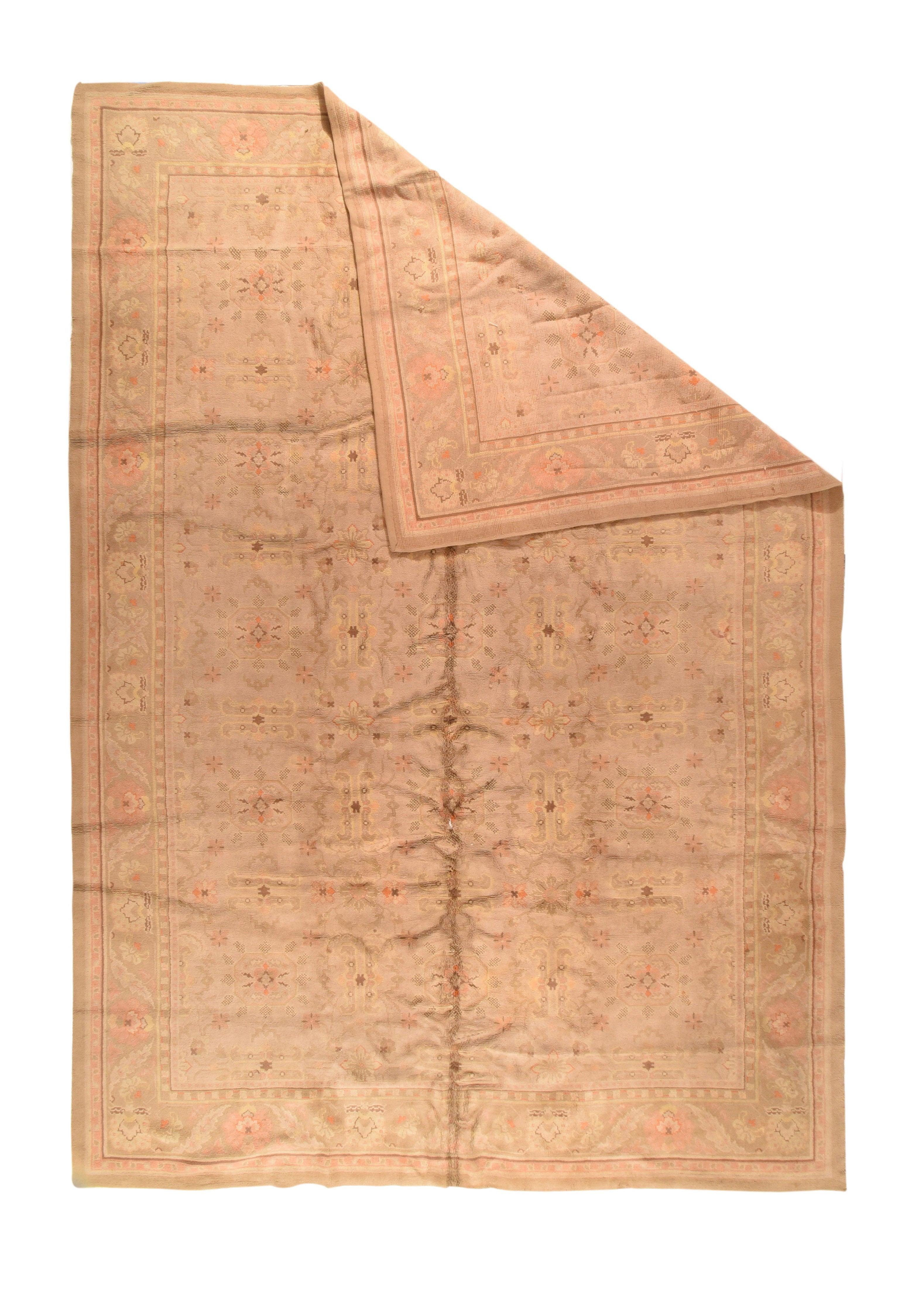 Fine Antique French Savonnerie Rug 11'9'' x 17'10''. This west Turkish town carpet features detail tones less distinct on the straw-buff field. Octagons and octofoil rosettes are the main field devices. Light burnt salmon border with palmettes and