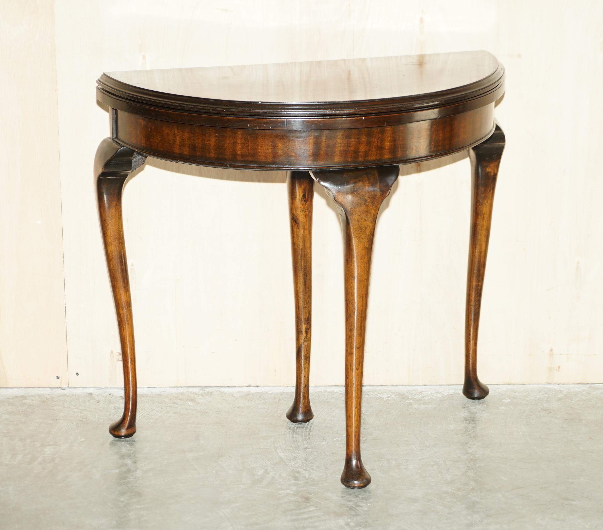 We are delighted to offer for sale this lovely circa 1880 flamed mahogany demi lune games card table with ornately carved legs

A very good looking and well made piece, made in the Regency style however it is late Victorian. The legs are