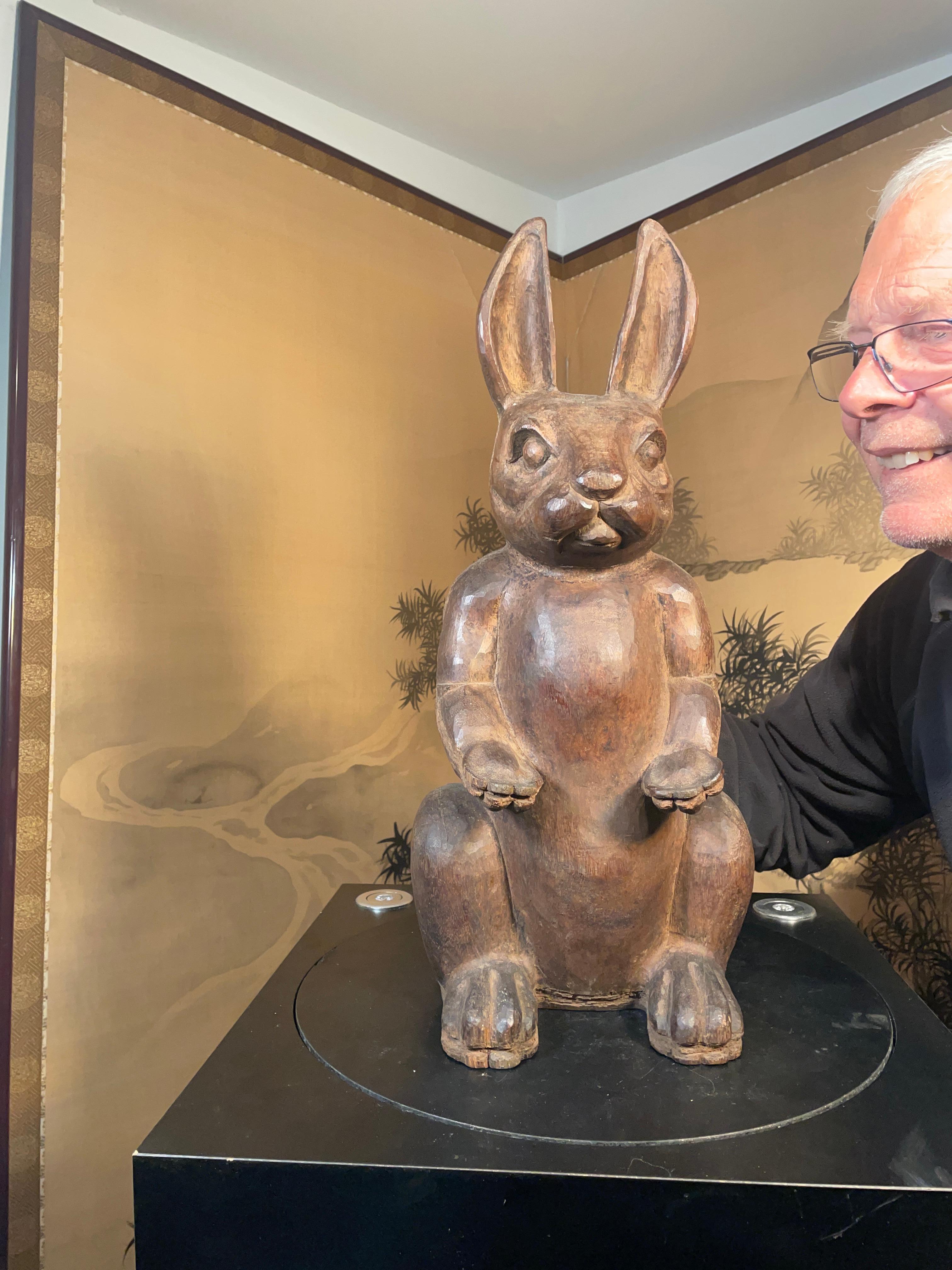 Coming from an American Folk art collection of animal sculptures- only one.

A fine huge, signed, and heavily hand carved charming erect rabbit measuring 21 inches tall and 9 inches wide- one of the largest hand carved rabbits we have ever seen. It