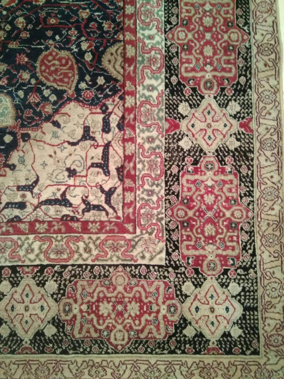 Very finely woven with lustrous wool, this elegant antique Indian Agra carpet is distinguished by a centralised pattern originating from a very rare 16th century Persian Safavid rug known as the Ardabil carpet, originally woven as a pair and now