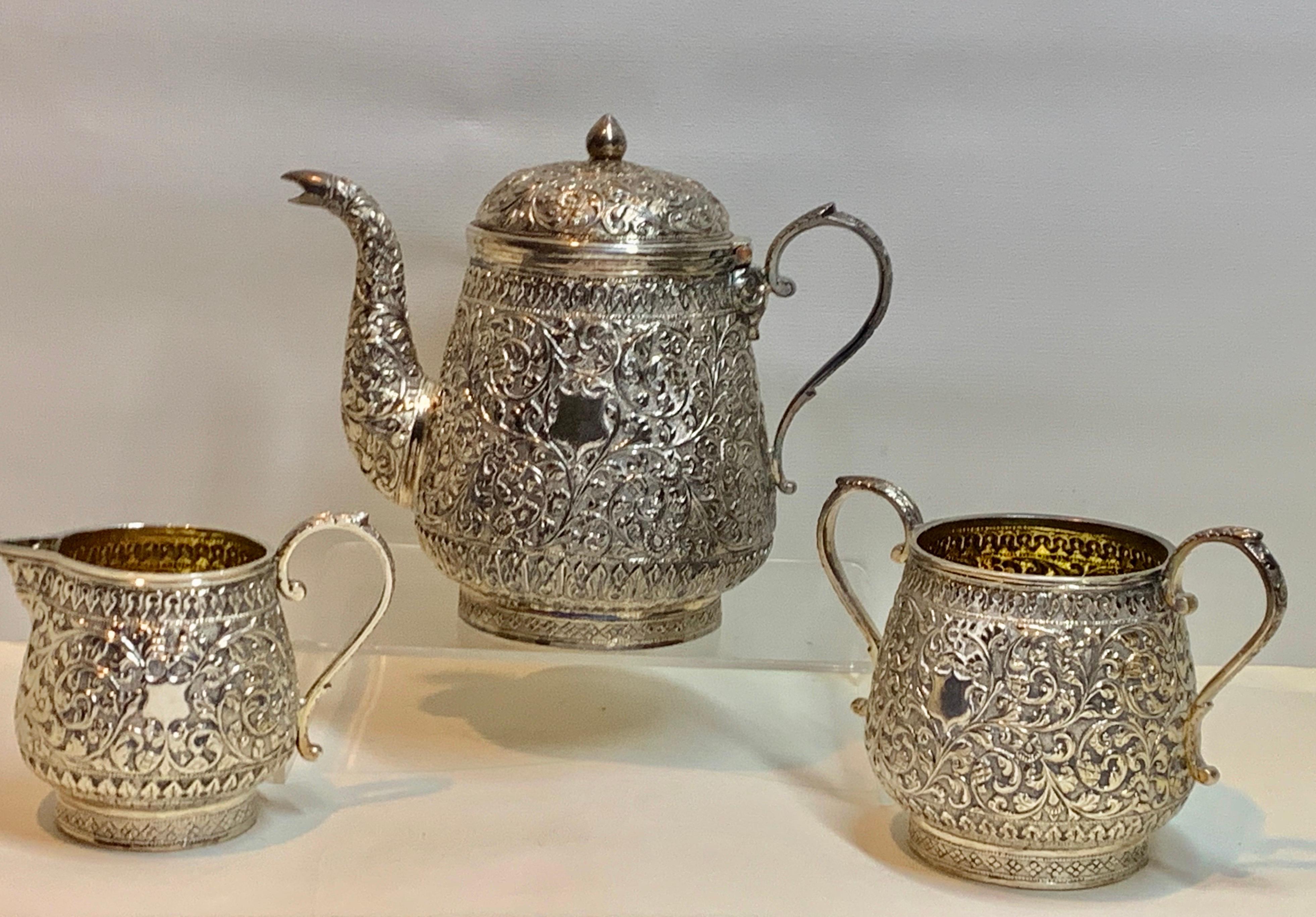 A wonderful Indian silver tea set comprising teapot, milk jug and sugar bowl. It is richly decorated with a dense floral pattern of the Western Kutch region and they date around 1850.
The interiors show signs of being gilded originally although it