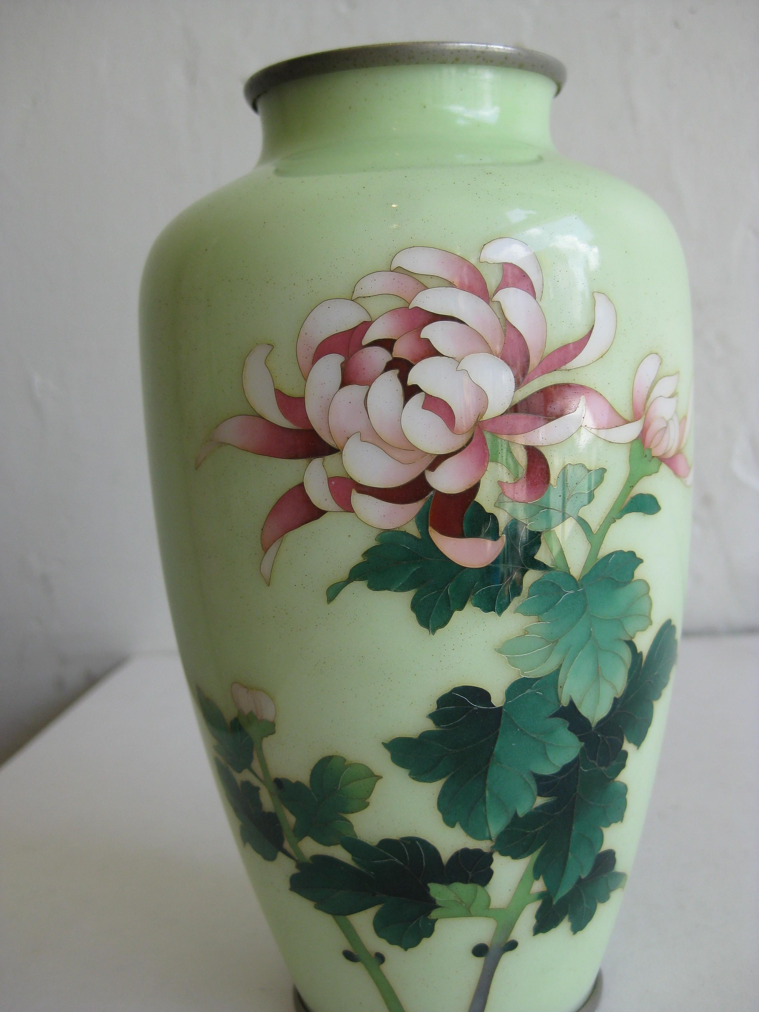Fine antique Japanese Cloisonne enamel vase by master artist Ando Jubei. Dates from the early part of the 1900s. Beautiful colorful chrysanthemum flower with a pale green background. Silver color metal mounts. Signed with the artist mark on the