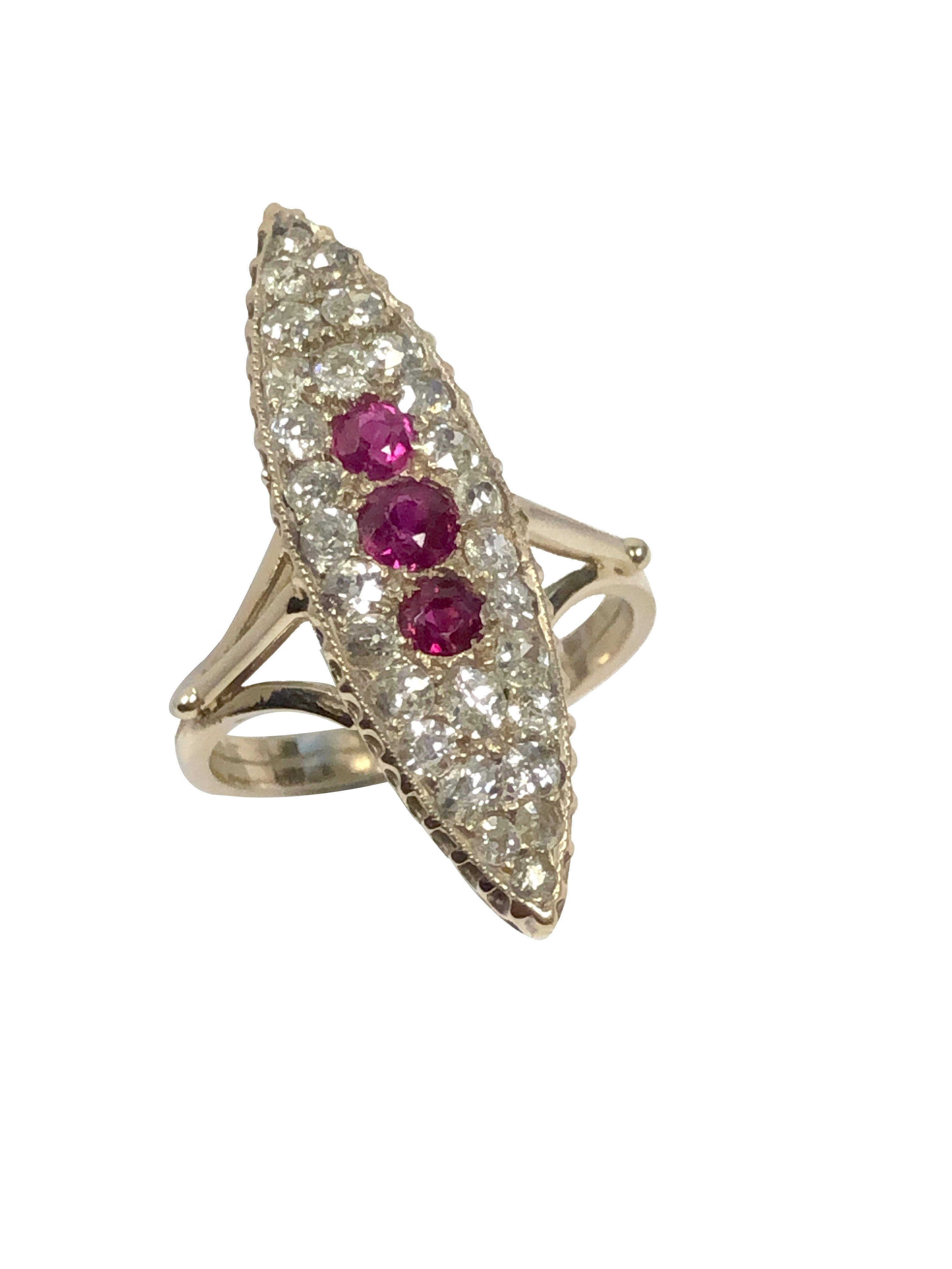Circa 1900 14k Yellow Gold Navette Ring, measuring 1 1/4 inches in length and 3/8 inch wide, set with Nice Clean White Old Mine cut Diamonds totaling approximately 1.75 Carats and Very Fine Color Rubies. Finger size 7 1/2. Excellent, seldom worn