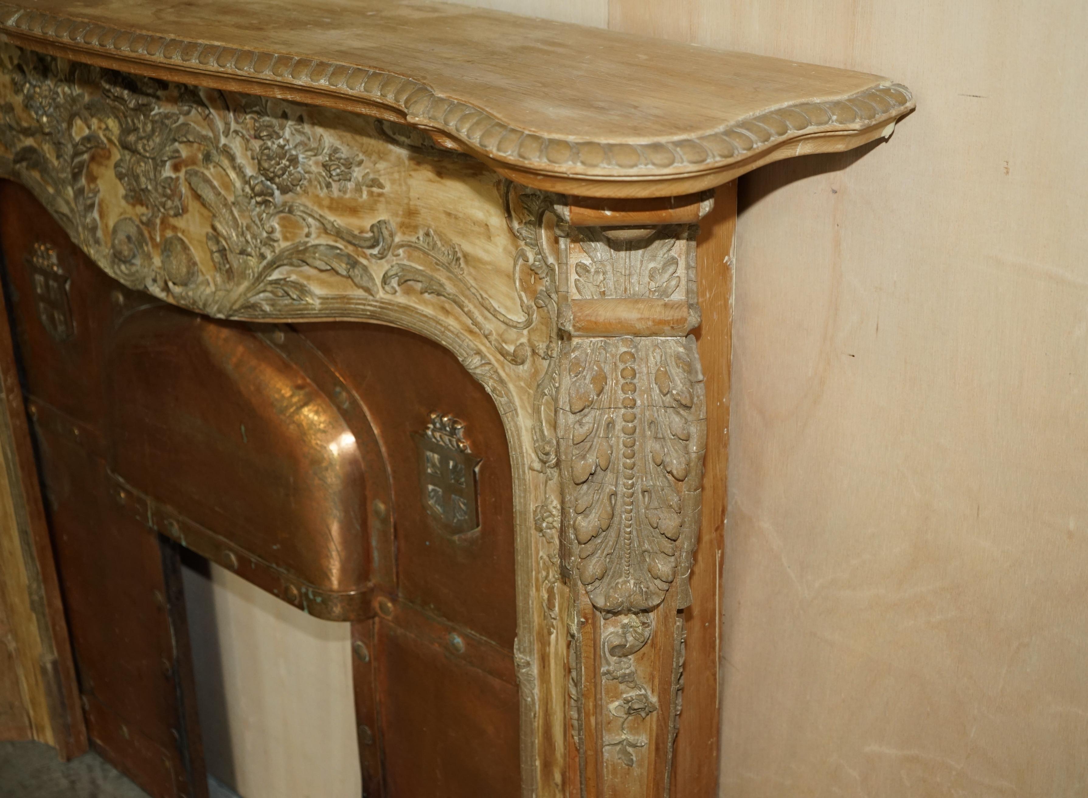 I'm delighted to offer for sale this very rare Antique hand carved Georgian Limed Oak Louis XV style fireplace with Arts & Crafts copper insert

What a find! Have you ever seen another fireplace this ornate, hand carved in oak and limed to this