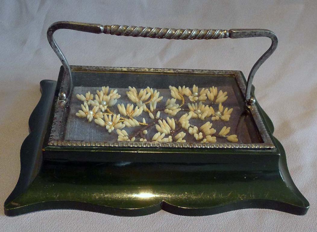 Fine early 19th century paperweight with highly polished green wooden base giving the impression of marble. Fine interior decoration under glass with cut steel bezel and a fine twisted cut steel handle ( probably Russian Tula cut steel work from the