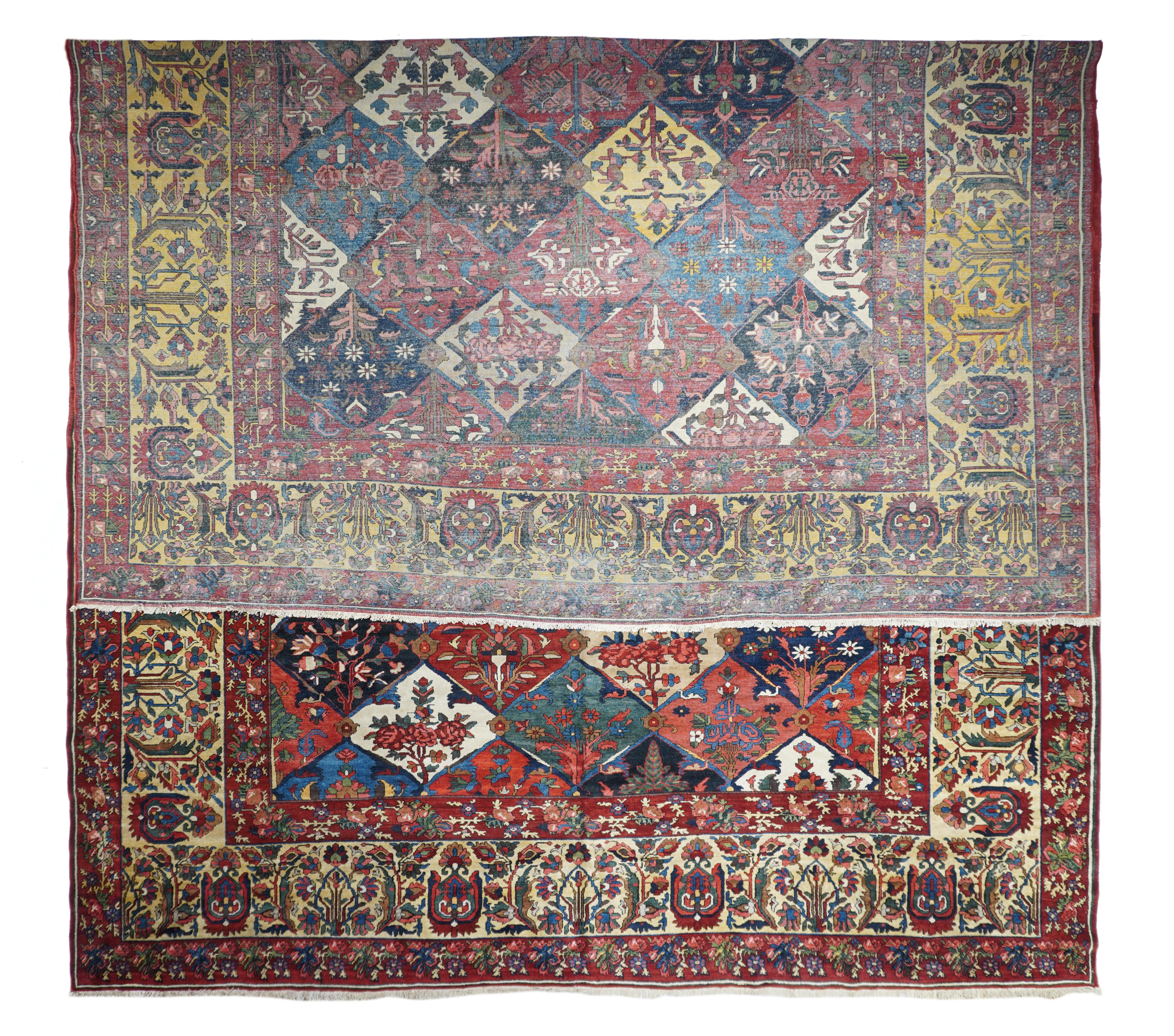 This central Persian Char Mahal district village scatter shows a scaliform escutcheon pattern in ecru, red, navy medium blue, straw, rust and blue-green, with standing complete flowers or escutcheons with “fish” leaf supporters enclosed therein.