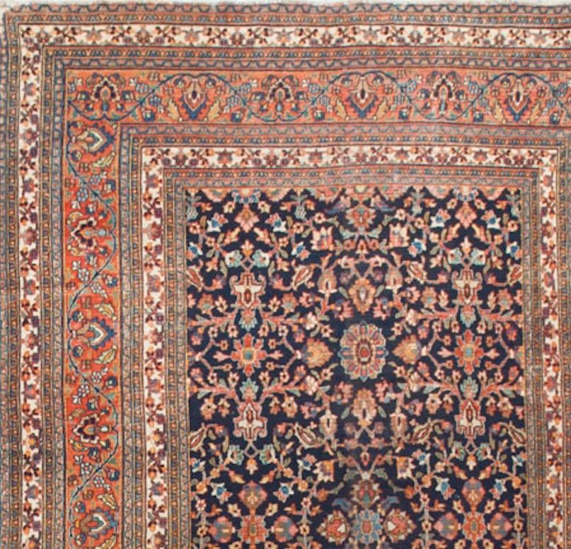 Known for producing large rugs that often have a European influence the rugs from Dorokhsh were very popular in France during the late 19th century. This rug features floral motifs in the central field enclosed by a border, itself enclosed by