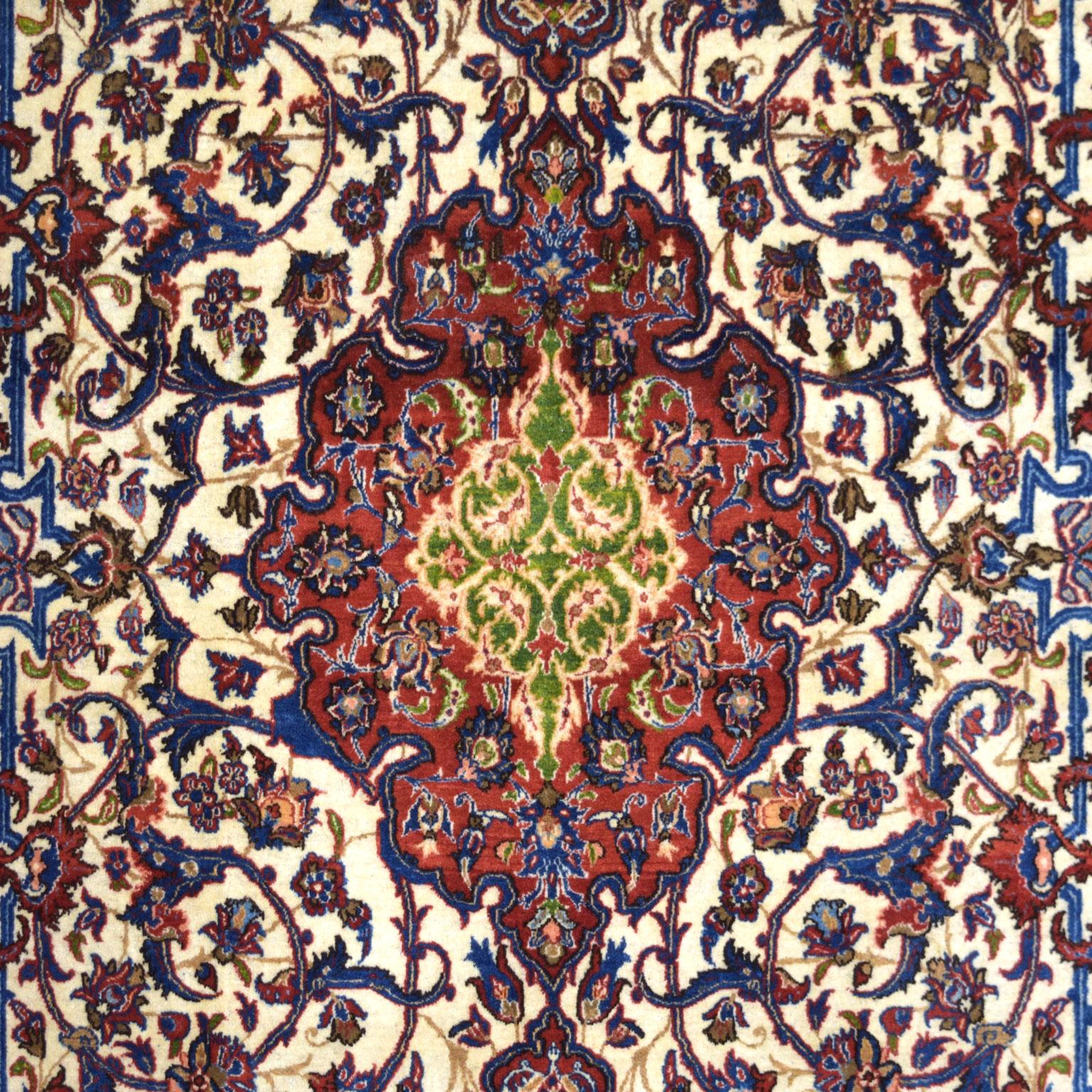 Named after the former capital and largest carpet-producing city of Persia, this exceptional Isfahan carpet is hand-knotted in pure wool and belongs to Orley Shabahang's Antique collection. Measuring 4’8” x 6’11”, this rug's hand-knotted weave