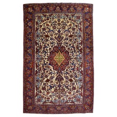 Fine Antique Persian Isfahan Carpet in Red, Cream, and Gold Wool