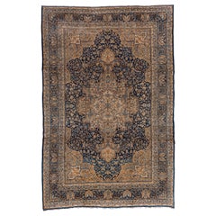 Fine tapis persan ancien de Kerman, tons or et bleu marine, vers les années 1920