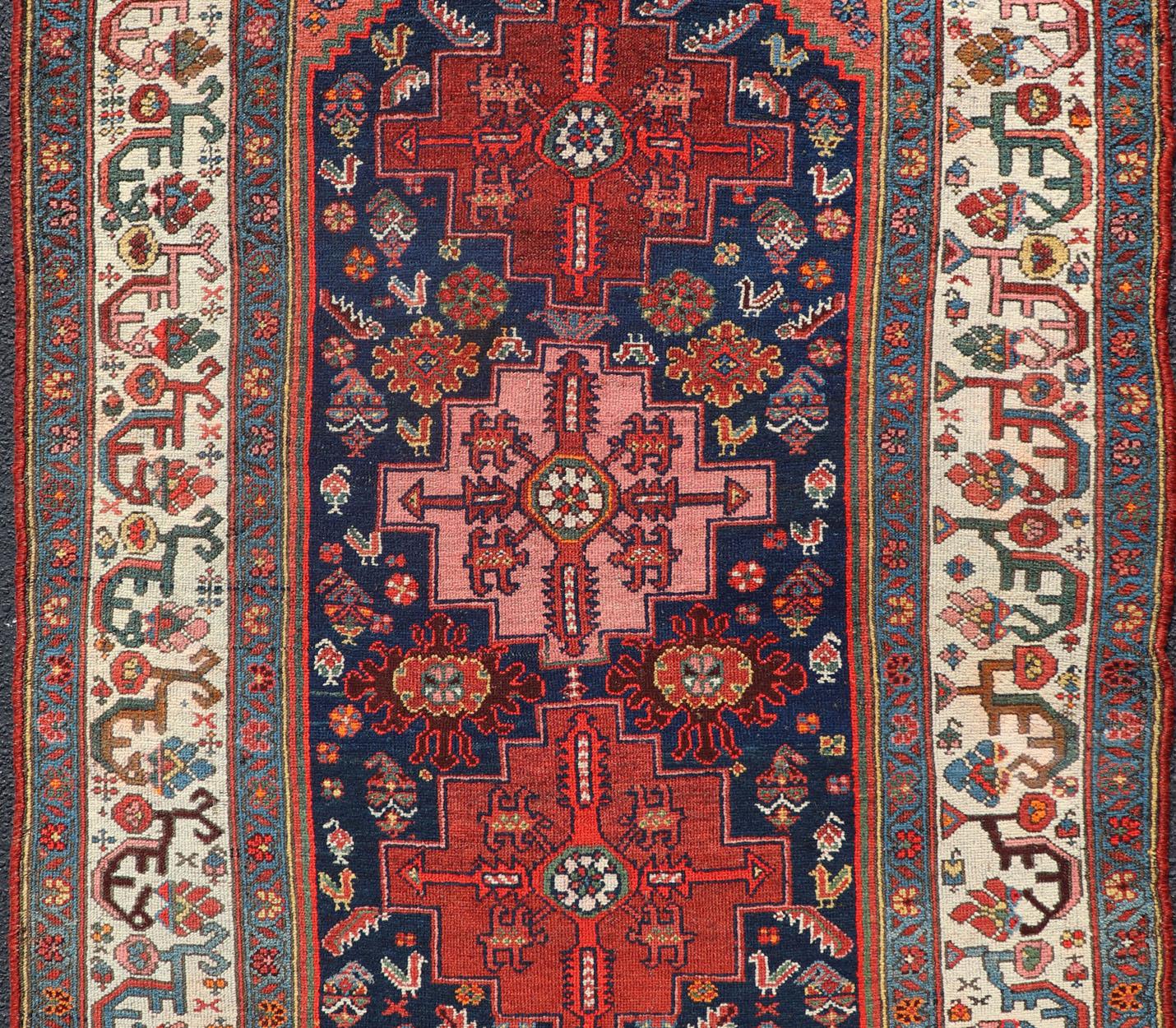 Hand-Knotted Fine Antique Persian Kurdish Rug with Medallion Design in Blue, Red, and Ivory For Sale