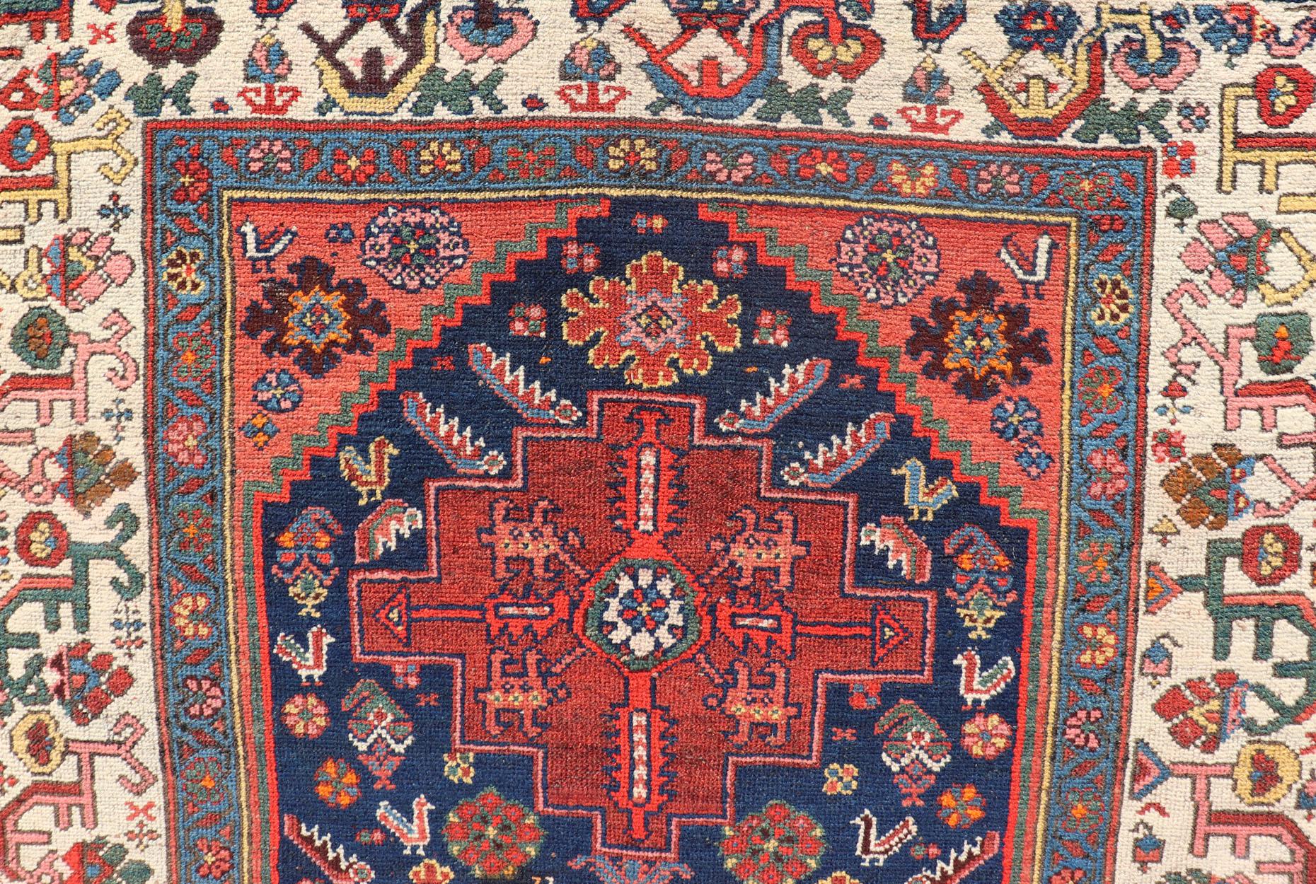 Fine Antique Persian Kurdish Rug with Medallion Design in Blue, Red, and Ivory In Good Condition For Sale In Atlanta, GA