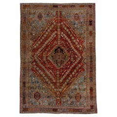 Magnifique tapis persan ancien Shiraz, fond intérieur rouille et rouge, fond extérieur bleu clair