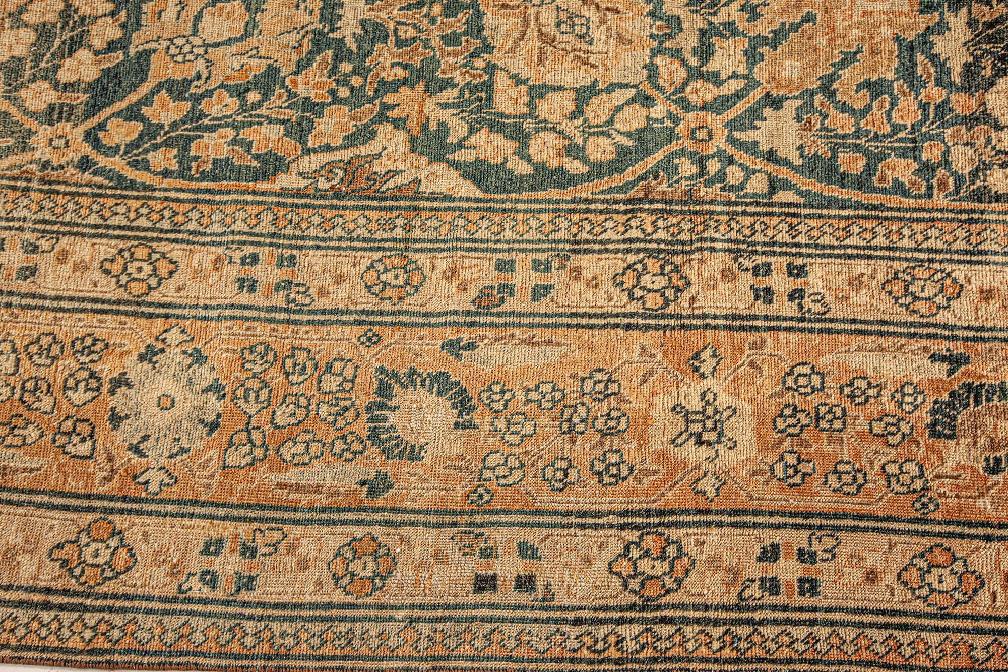 Antique Persian Tabriz handmade wool rug
Size: 9'6