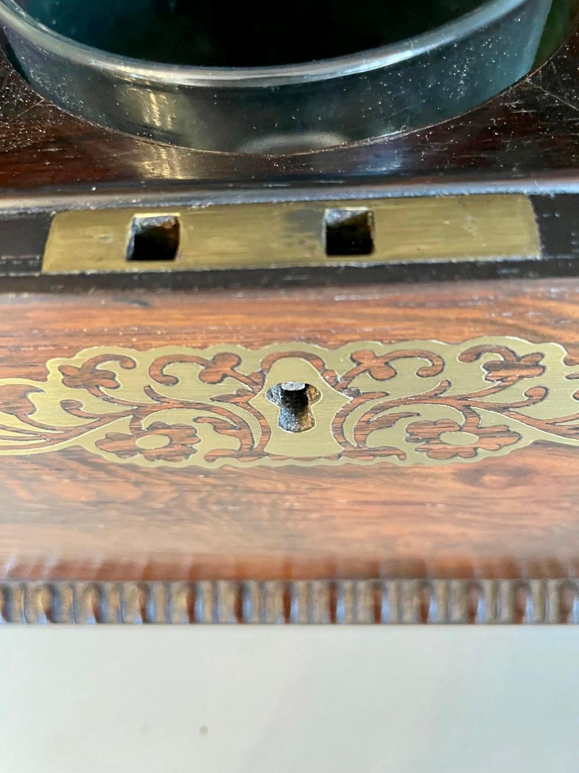 Fine antique Regency inlaid brass rosewood tea caddy having a spectacular inlaid brass top and carved moulded rosewood edge, lift up lid opening to reveal a fitted interior with the original lift out tea caddies, inlaid brass to the front with a