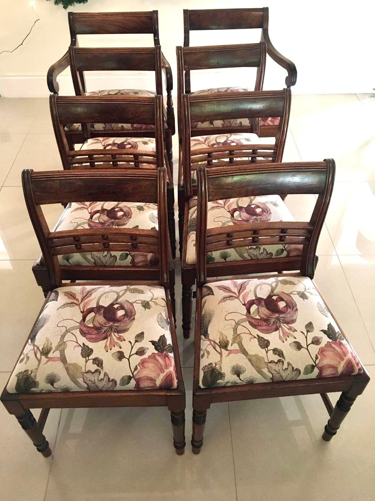 Fine antique set of eight George III mahogany dining chairs consisting of two carver chairs and six dining chairs. They all boast superior figured mahogany backs with reeded splats to the centre with fantastic turned balls. The carver chairs having