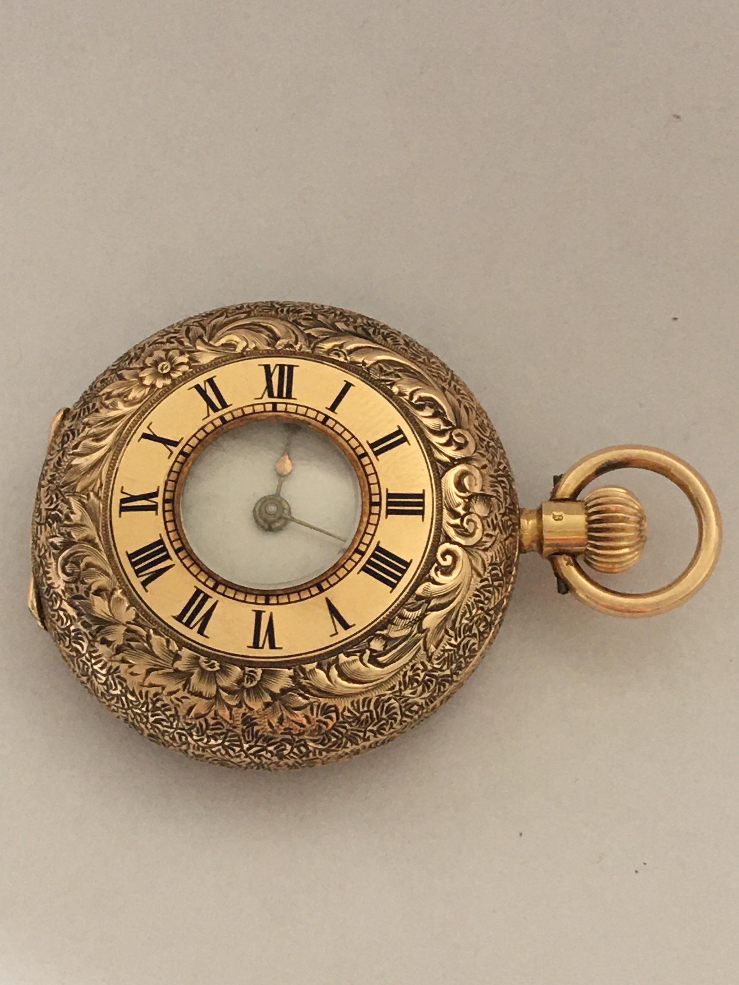 small gold pocket watch