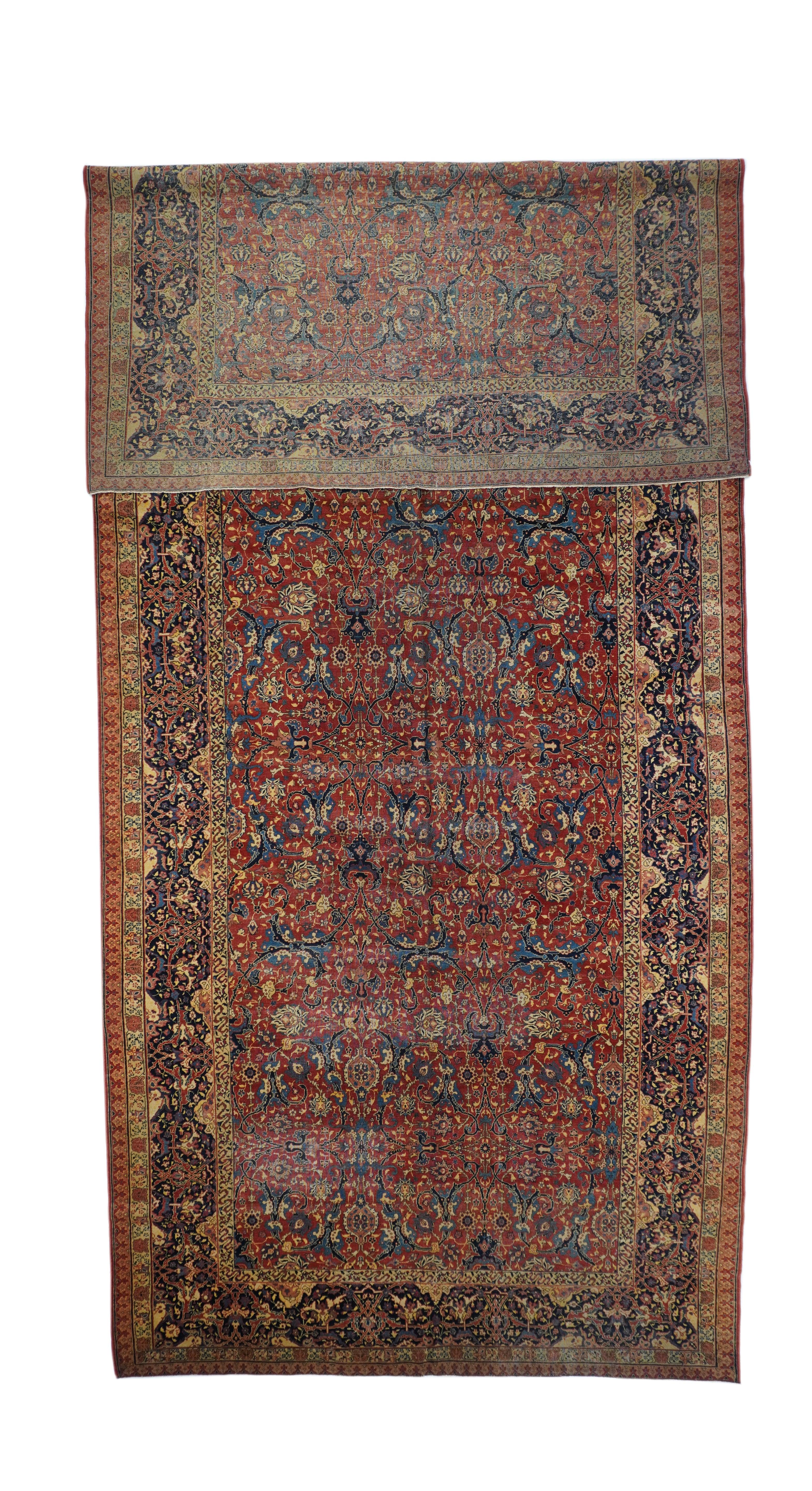 Fine Antique Tabriz Rug 7'8'' x 17'4''. A slightly irregular navy cartouche and arabesque main border perfectly frames the saturated cardinal red field with a finely detailed allover design of petal palmettes, navy vigourously curling split acanthus