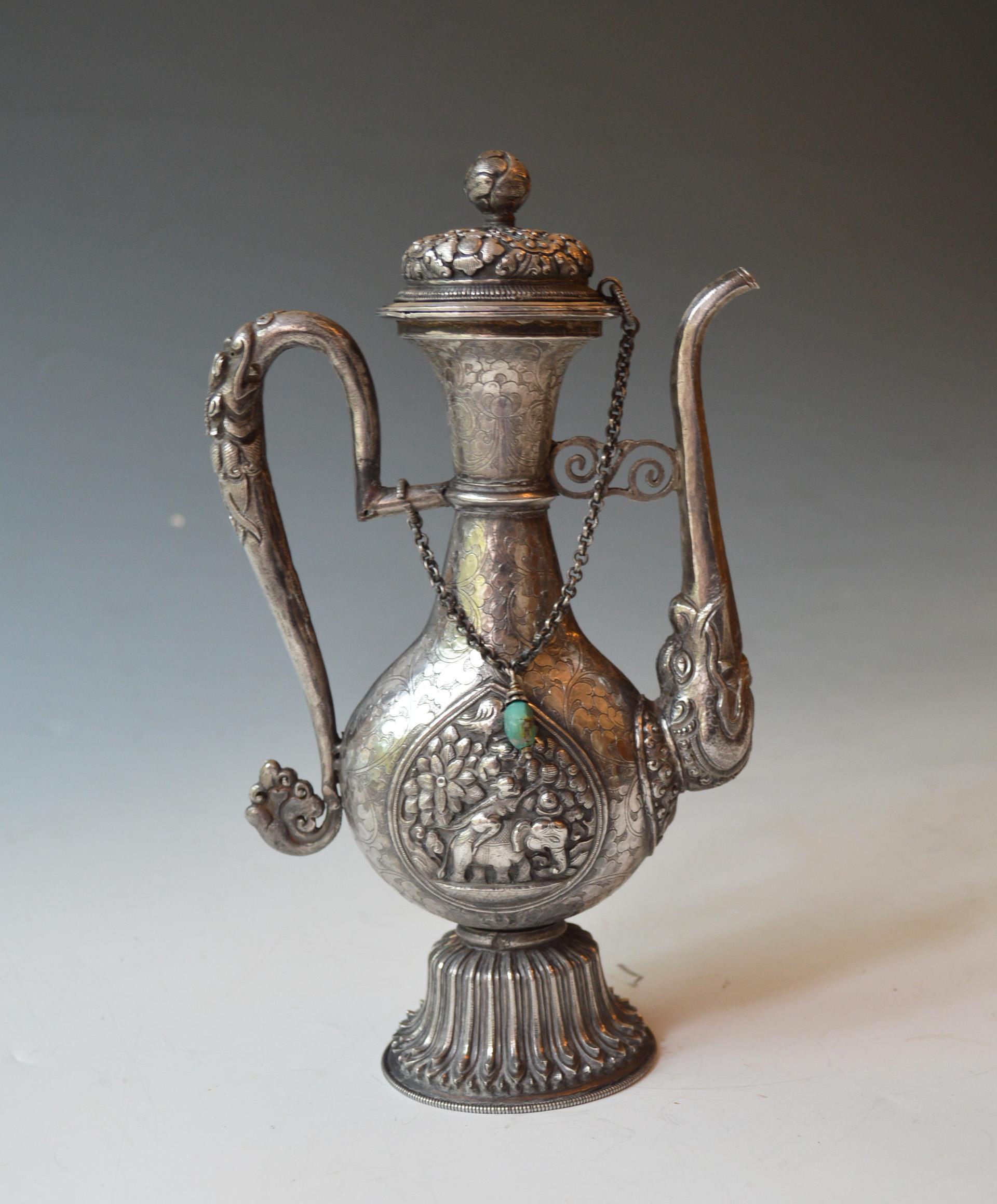 Fine Antique Tibetan Ritual Silver Ewer Asian Chinese Buddhist antiques 
 
A ritual water ceremony ewer very finely crafted in high grade silver with hammered chased and repoussé Buddhist designs all over  
Height   24  x  W 15 cm. 475 grams
Period
