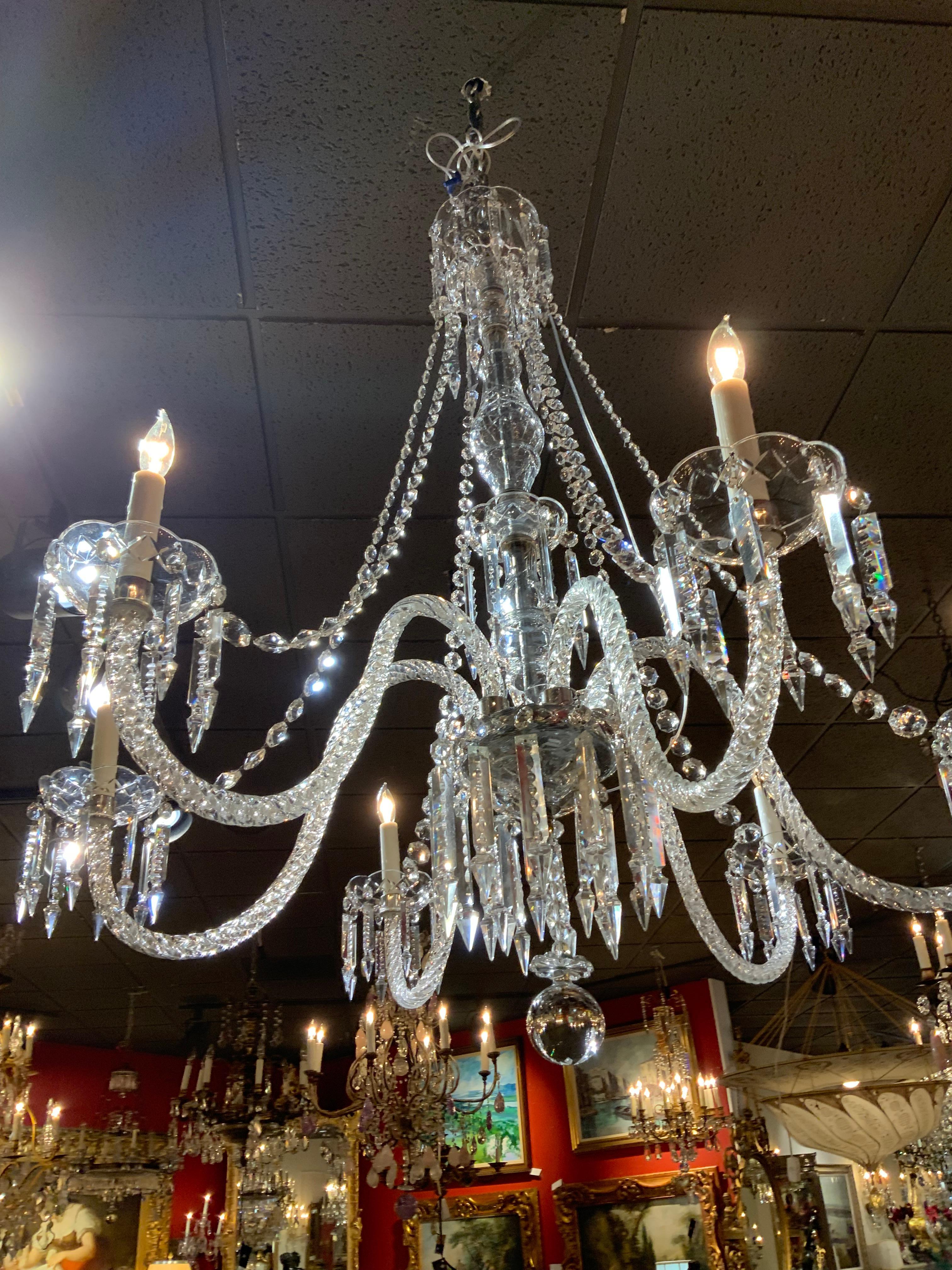 Fine clear crystal makes this chandelier special. The central
Post is the full length of the piece. Scrolling arms with
Six lights eminate from the center. Long beads connect from
The upper bobeche in a graceful arch to each light. It has 
New