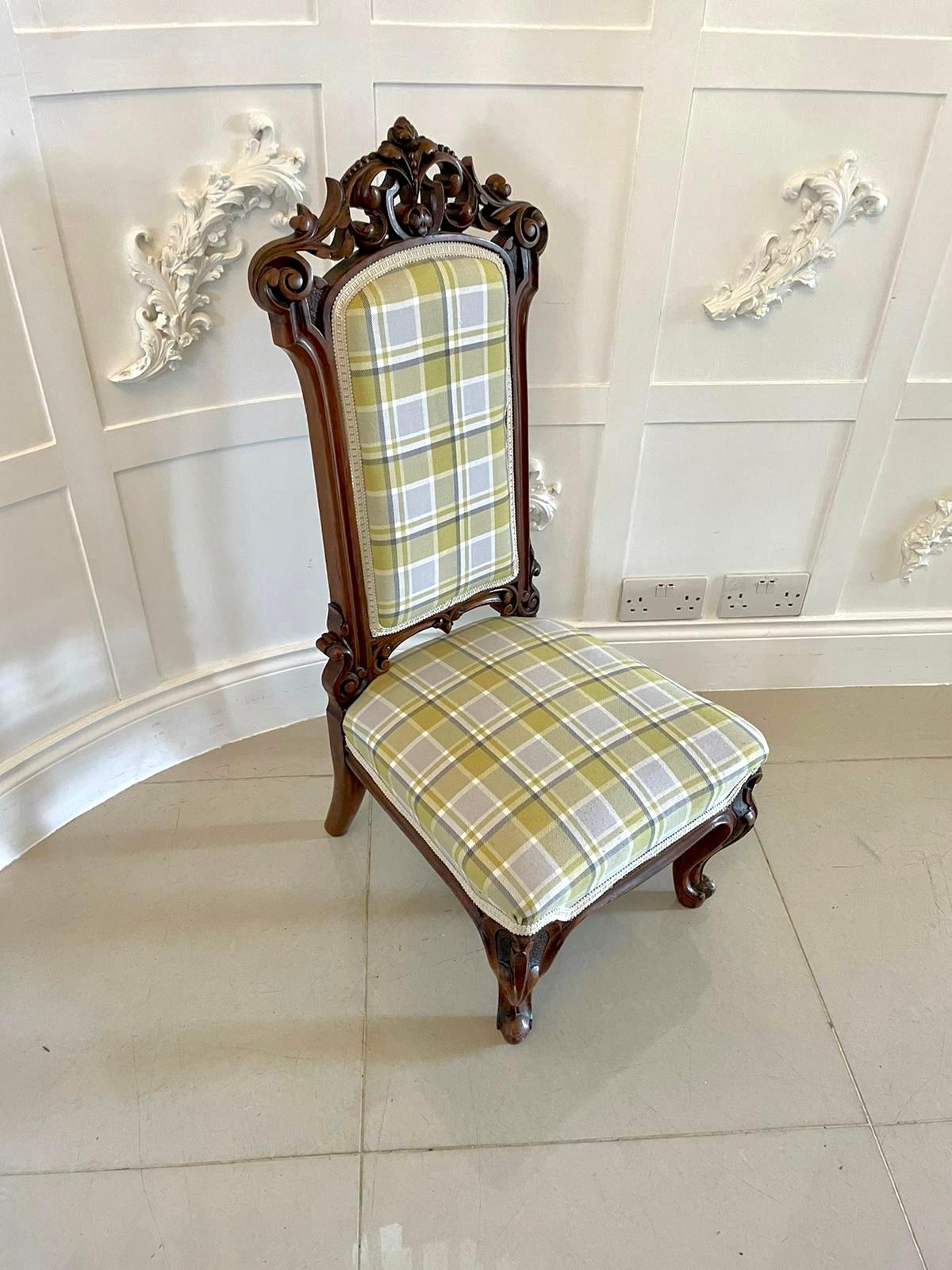 Fine Victorian carved walnut ladies chair having a finely carved shaped top with carved sides and legs. The padded back and seat have been newly upholstered using a quality fabric. It is supported by two elegantly shaped carved cabriole legs to the