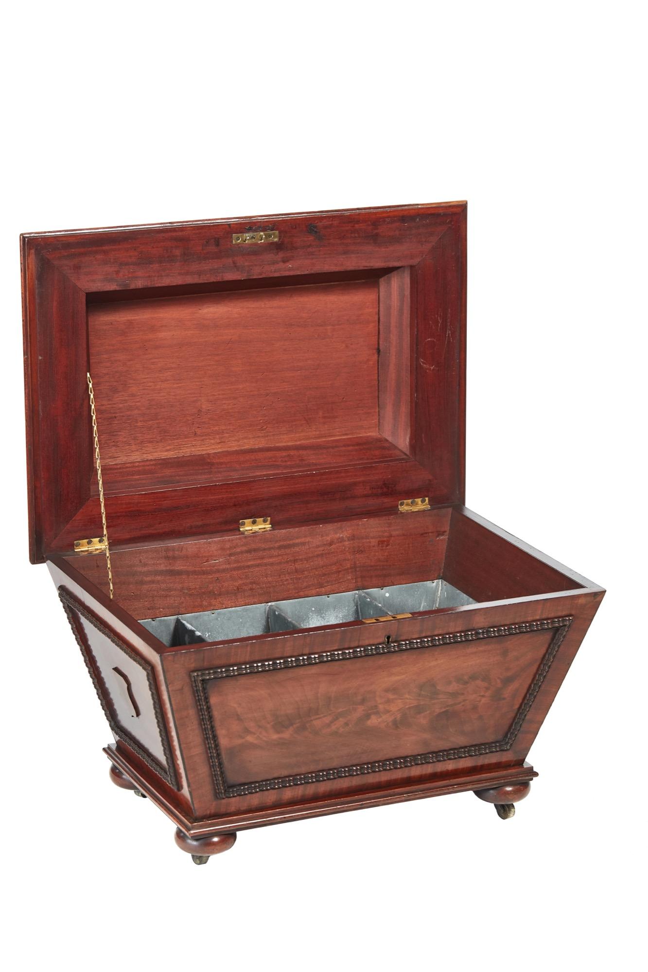 This is a fine antique William IV antique carved mahogany wine cooler in a sarcophagus shape, fantastic quality expertly carved lift up lid, original fitted interior, beautiful carved mouldings to the front and sides. It stands on bun feet with