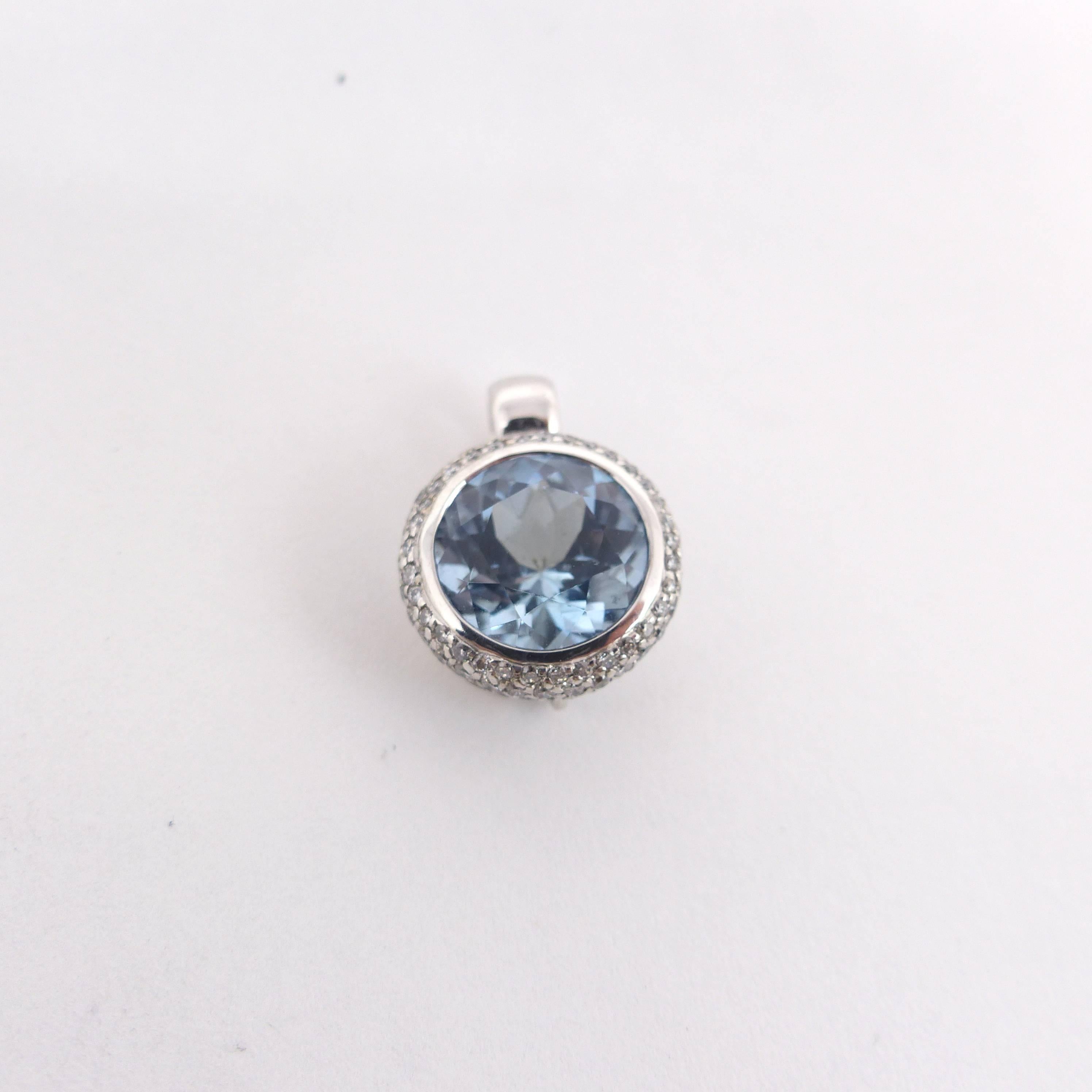 Thomas Leyser is renowned for his contemporary jewellery designs utilizing fine gemstones. 

This 18k white gold (4,35gr.) pendant is set with 1 top quality Aquamarine facetted round 10mm, 3,59cts. + 99 diamonds brillant cut round 1mm pavé G(VS).