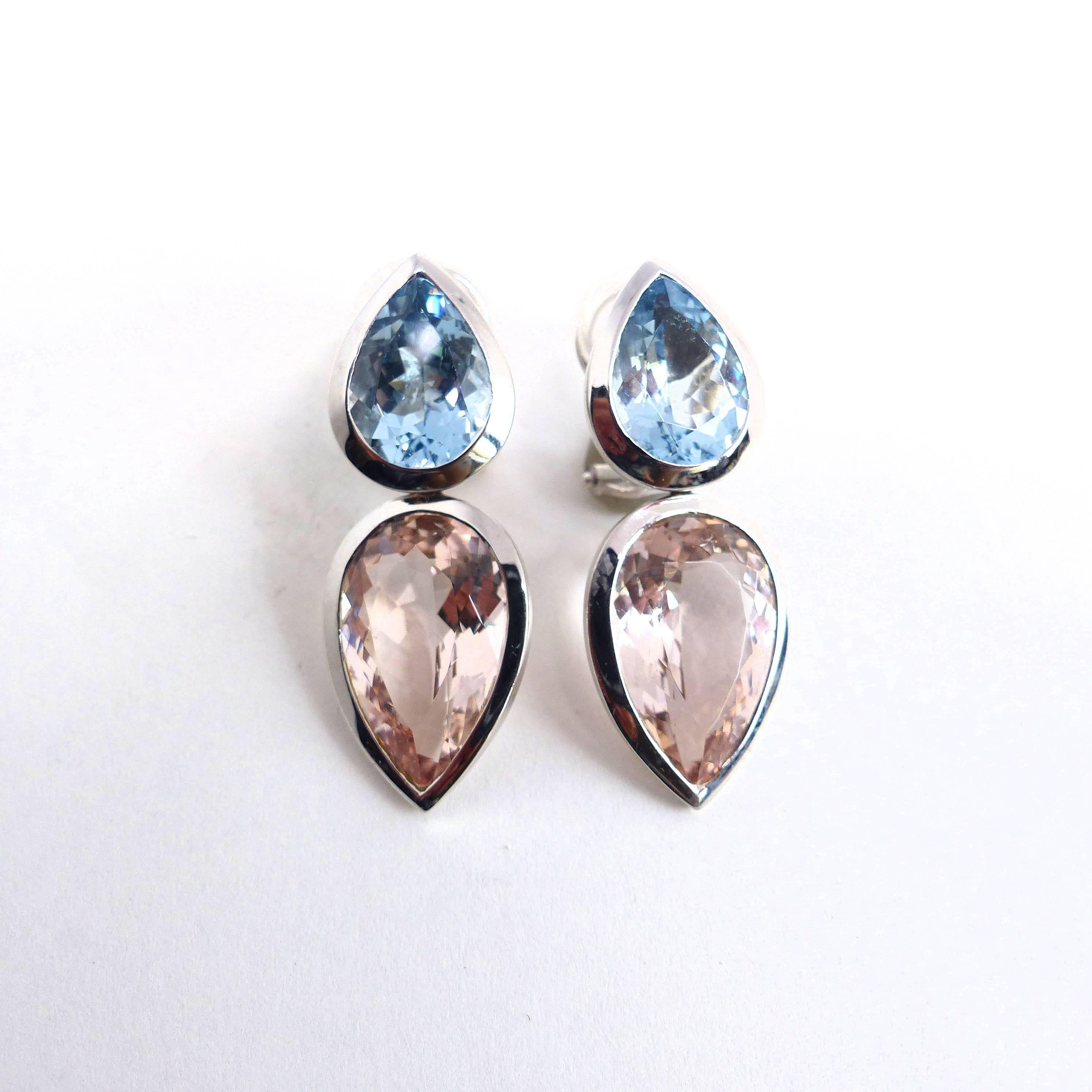 Thomas Leyser is renowned for his contemporary jewellery designs utilizing fine gemstones.

This 18k white gold (15.46g) pair of earrings has 2 top quality Aquamarines, facetted in pear shape (12x9mm, 5.77ct) + 2 top quality Morganites, facetted in