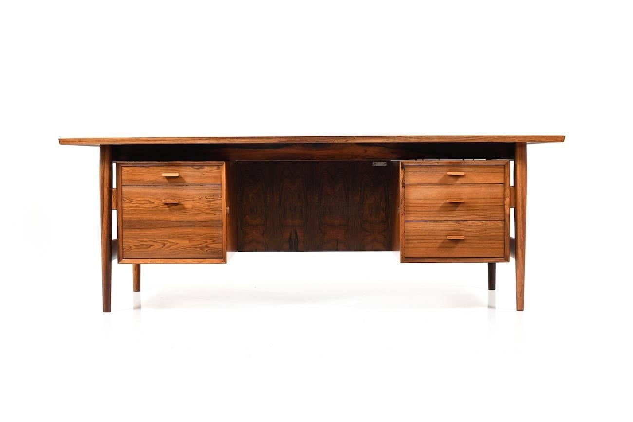 Big Arne Vodder writing desk in rosewood. Manufactured by Helge Sibast (Sibast Furniture Denmark) in 1960s. Five drawers with inlays in aluminium. Nice vintage condition. Measures: 204 x 104 cm.