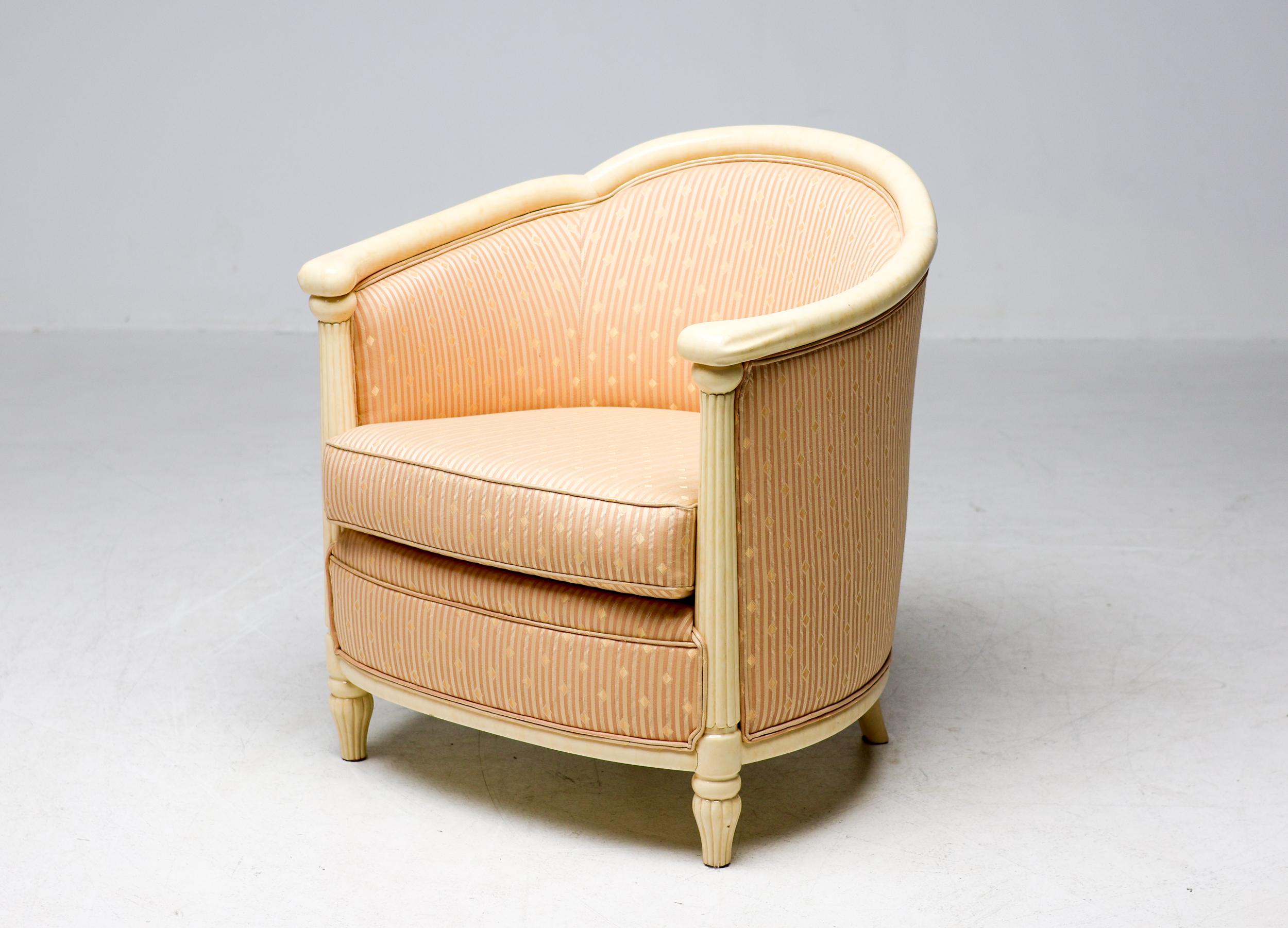 Beautifully crafted Art Deco chair. Marbled off-white paint on the carved solid wood framework. The delicate and very elegant damask fabric is in wonderful all original condition.  This is an excellent choice either as an accent chair in a vestibule