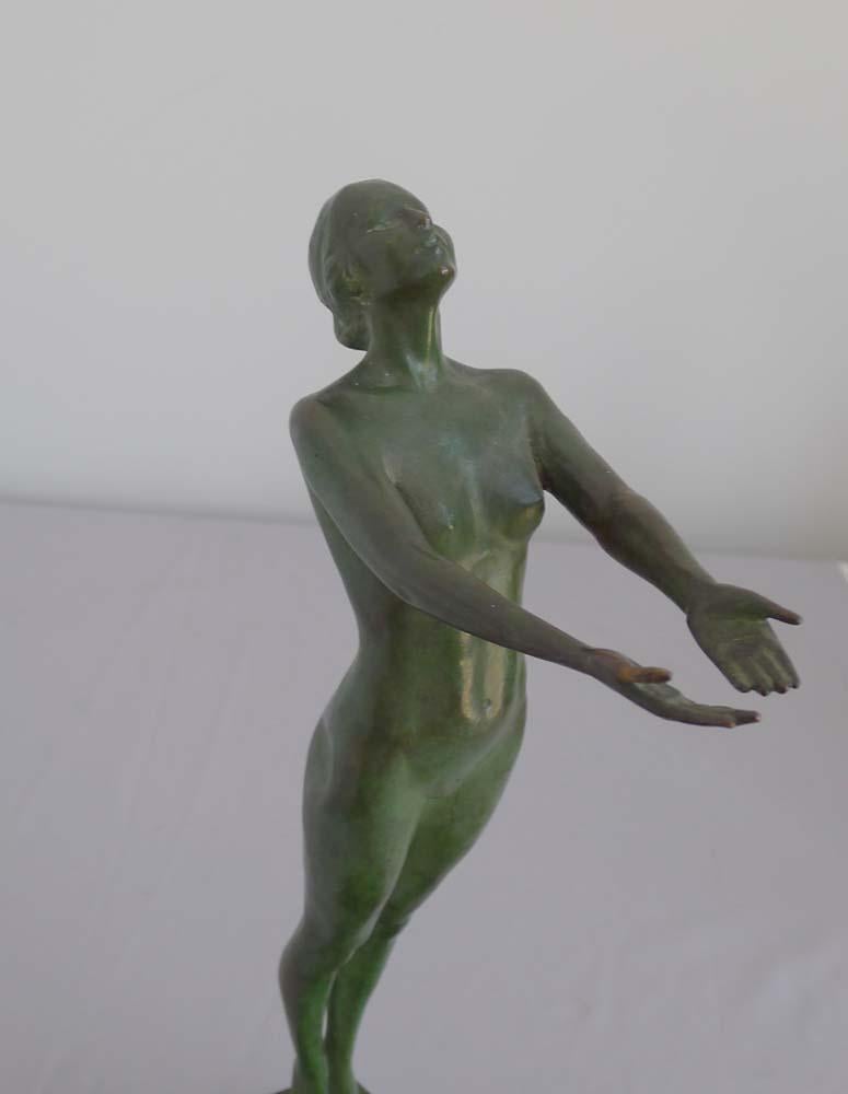 Fine Art Deco bronze nude on shaped marble base. Female nude standing on the lip of a dish with arms outstretched. Set upon a lozenge shaped piece of beautifully figured marble. Very sexy bronze. Indistinctly signed, circa 1927.