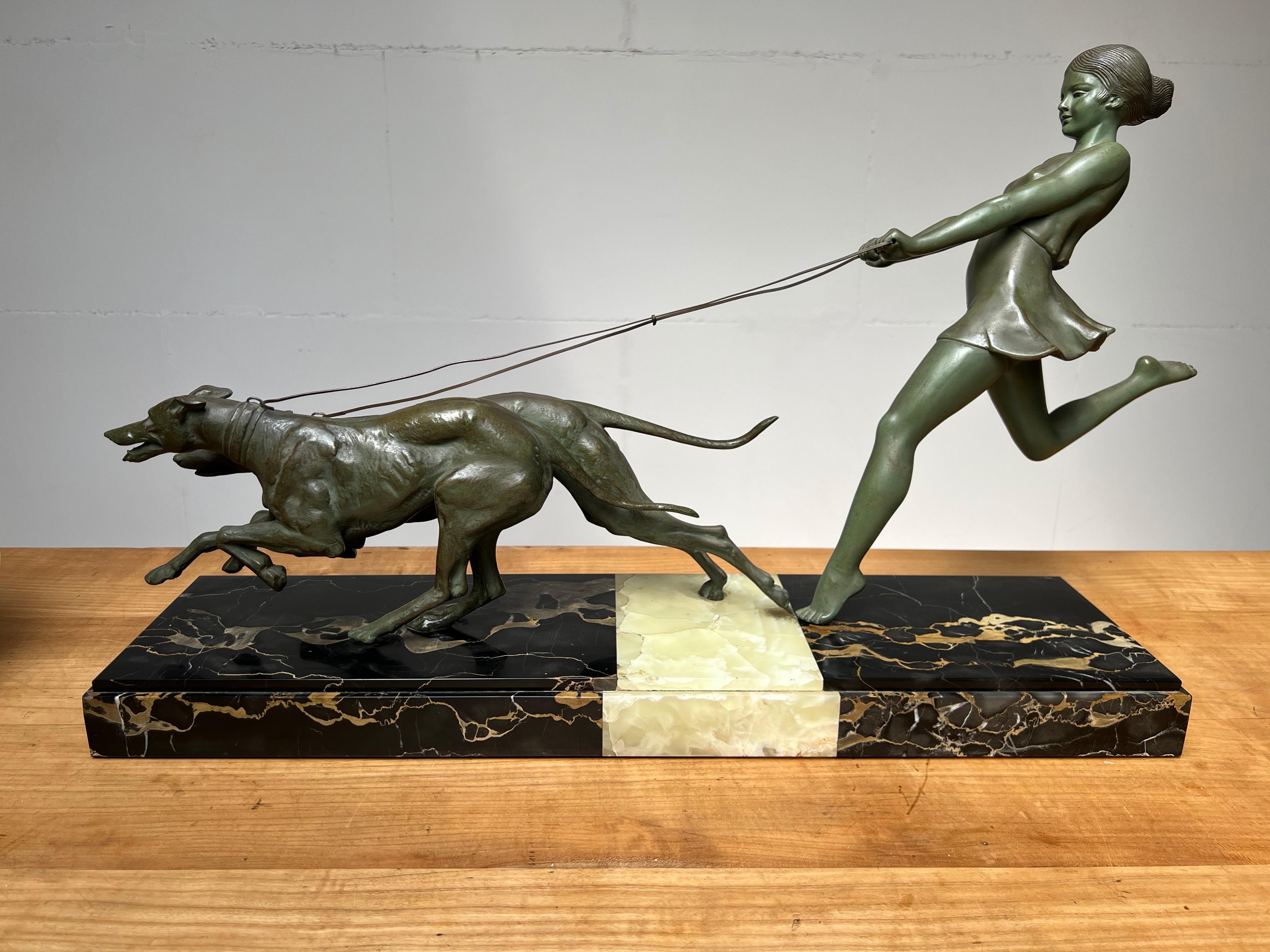 Fine Art Deco Bronzed Statue Girl with Greyhounds by French Sculptor Geo Maxim In Good Condition In Lisse, NL