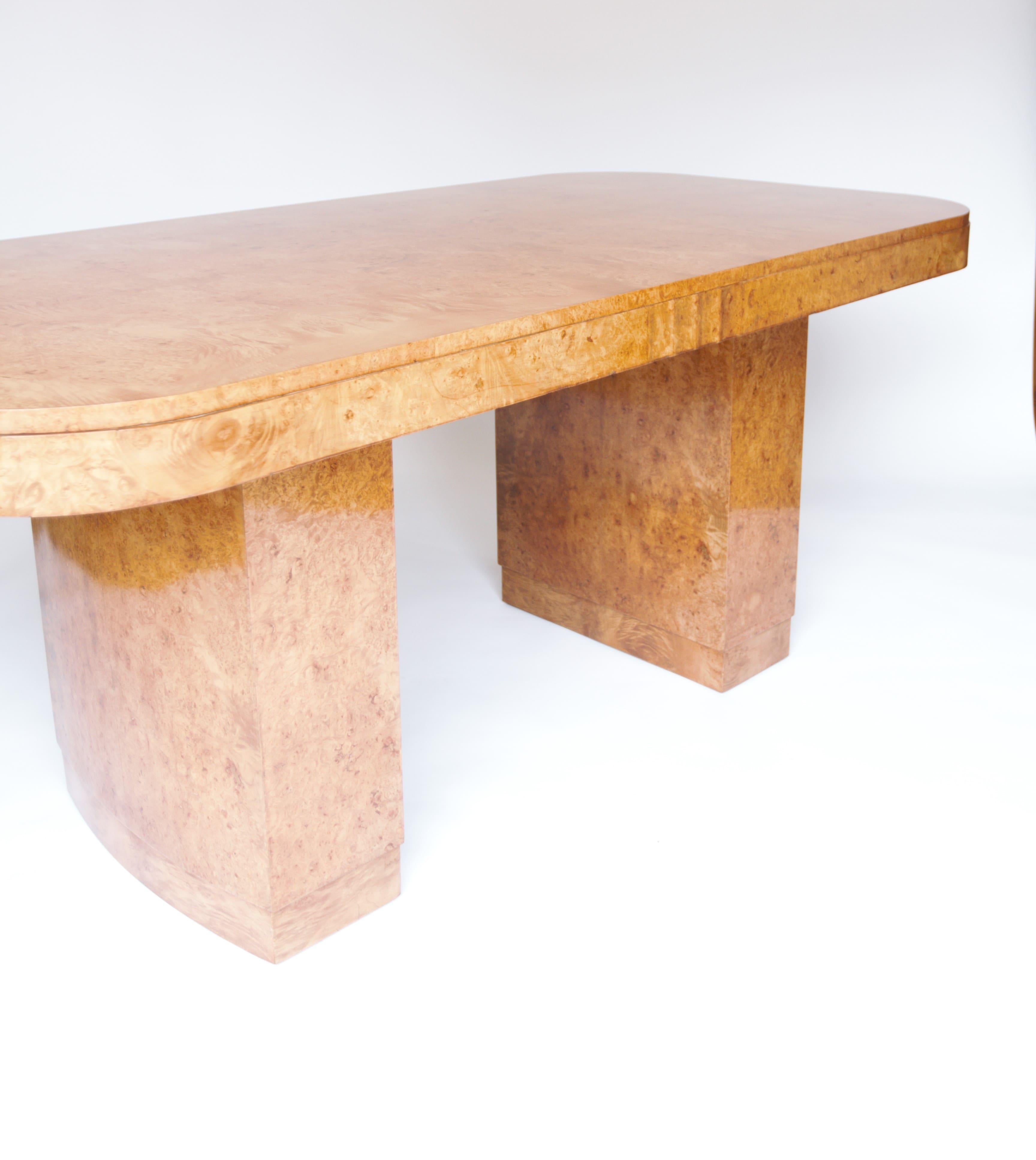 Fine Art Deco Burr Walnut Dining Table circa 1930s
Attributed to H& L Epstein
Fine Burr walnut veneer on top,
Frieze with burr walnut & ripple effect detail each side, 
Pair twin pedestals with fine burr walnut veneer around, 
stepped in bases,
