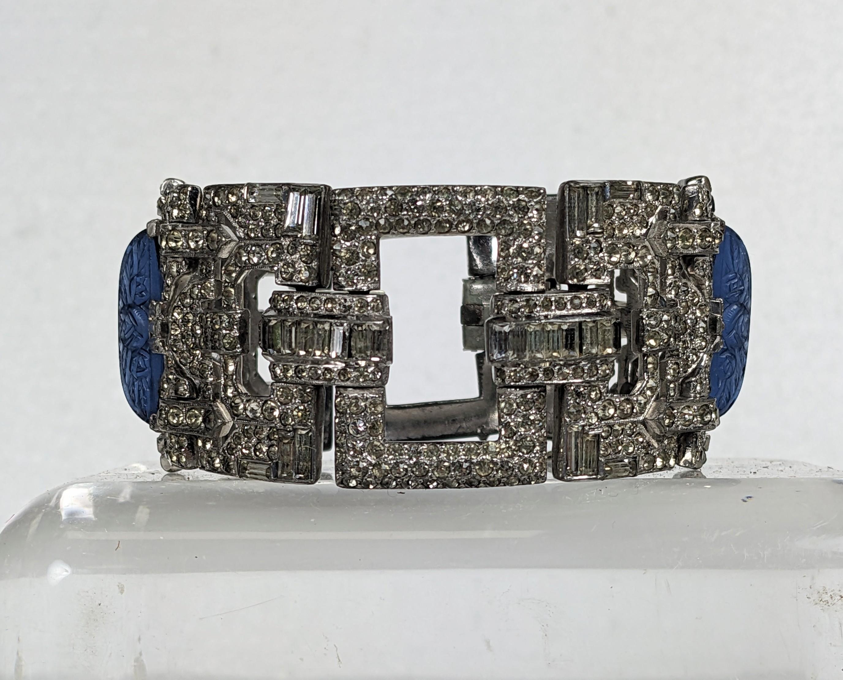 Fine Art Deco Pave and Molded Glass Bracelet from the 1930's. Pierced Art Deco panels are hand set with crystal pave and baguettes. 2 large molded sapphire glass Lalique style crystals are set within baguette settings. Unsigned but the quality of