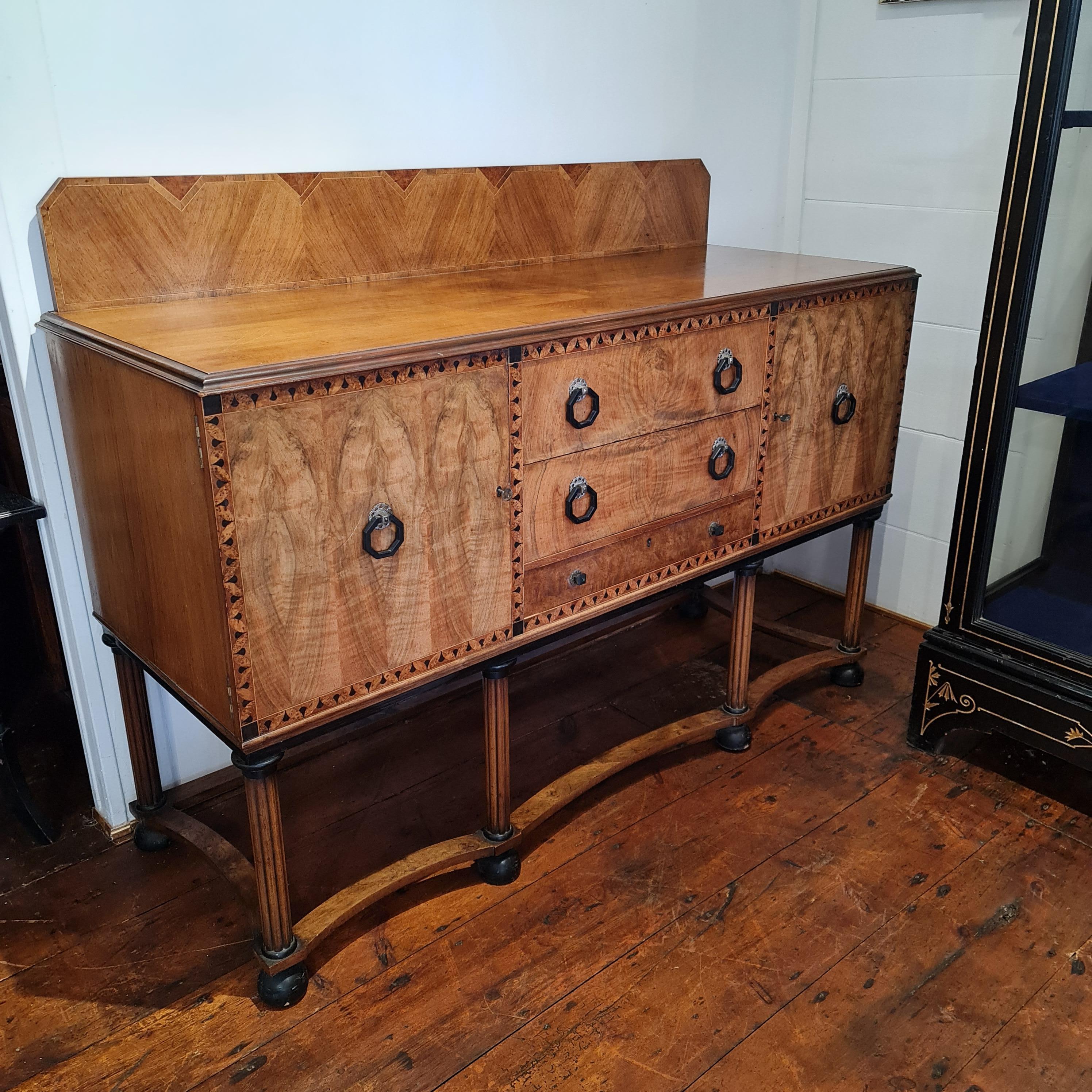 Fine quality original Art Deco sideboard by Waring & Gillow circa 1930. This is a beautifully constructed sideboard with well figured walnut veneers, solid mahogany drawer linings with hand cut dovetail joints . It has it's original zinc lined