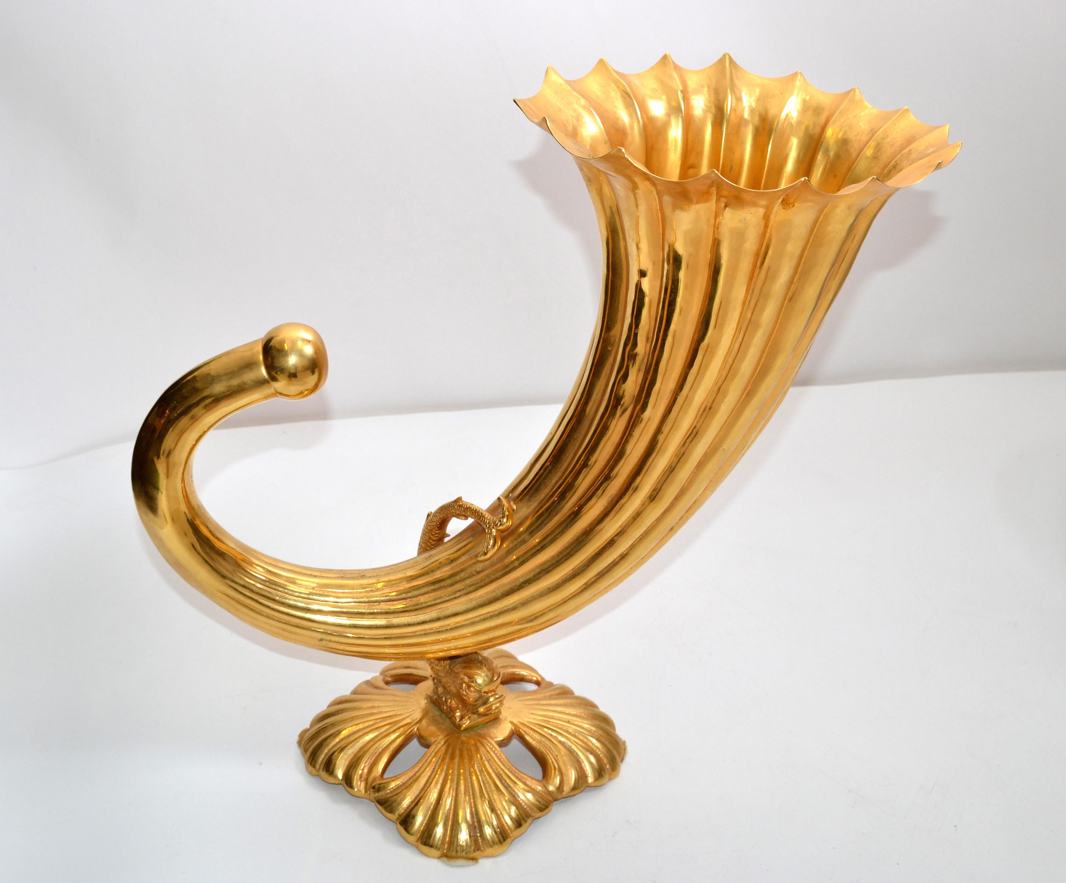 Art Nouveau Italian cornucopia vase in gilt bronze from the late 20th century.
The neck is surrounded with a Sea Serpent and is mounted firmly on a square base. 
The Cornucopia Vase is in good vintage condition with some tarnish inside the fill