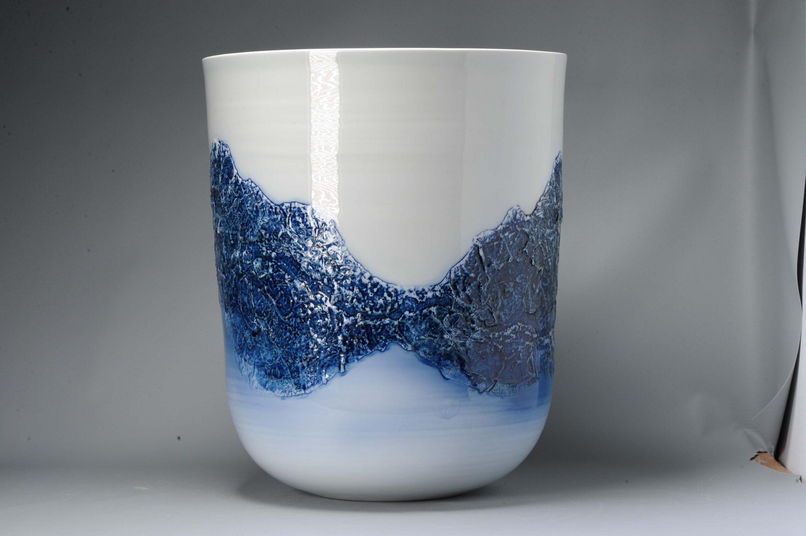 The Arita landscape is depicted in this work, as Mr. Aki Fujii imagined in his mind. It has a scene of Mountains in relief. The pot is 39cm high and 32cm in diameter or 15.35 inches high and 12.60 inches in diameter, and it is a true masterpiece of