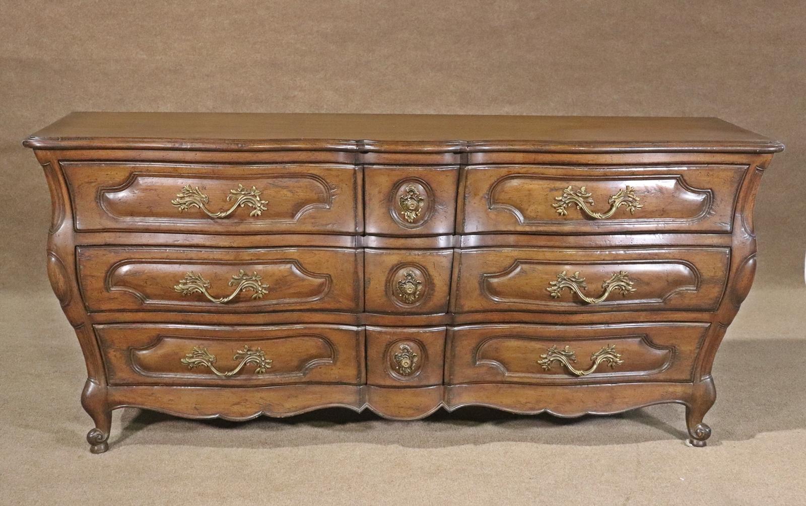 Wood .Carved. 9 drawers. Brass hardware. 34 3/4