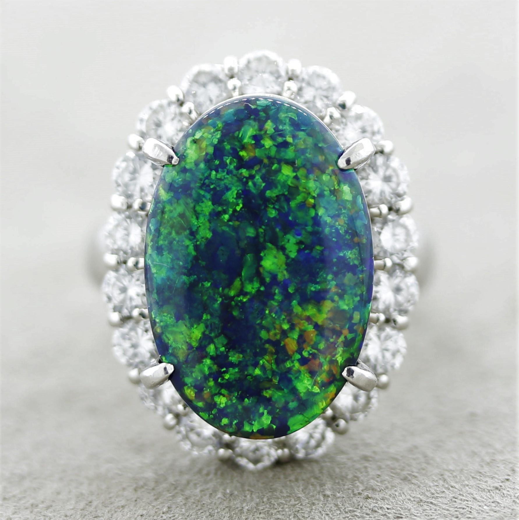 A superb gem black opal from Lightning Ridge, Australia. It weighs 7.79 carats and has excellent play-of-color and fantastic brightness. Intense vivid flashes of green, blue, orange, and yellow dance across the stone. It is complemented by 1.69