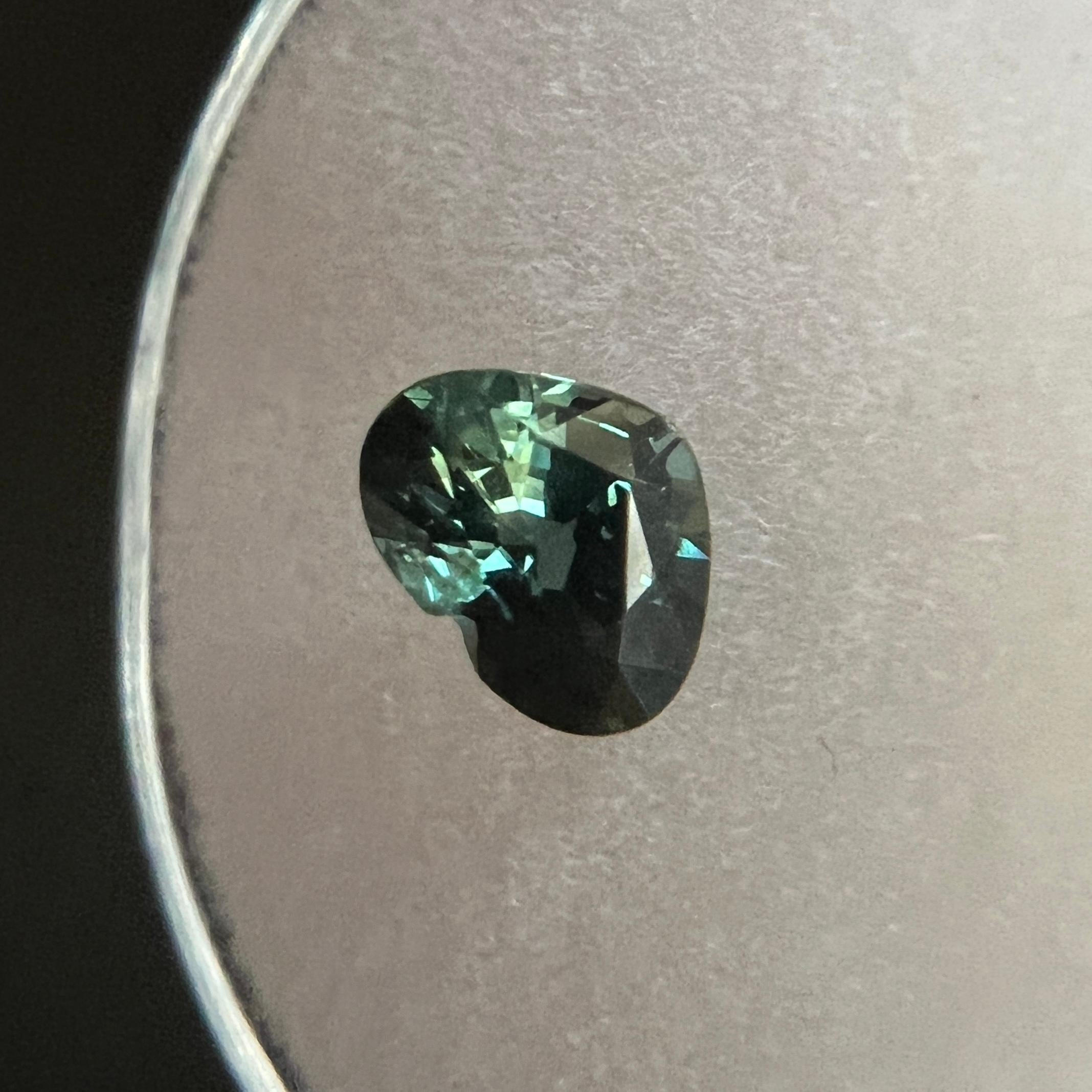 Natural Green Blue Parti-Colour/bi colour Australian Sapphire Gem.

0.91 Carat with a beautiful and unique green blue bi colour. Very rare and stunning to see.

Has good clarity, a clean stone with only some small natural inclusions visible when