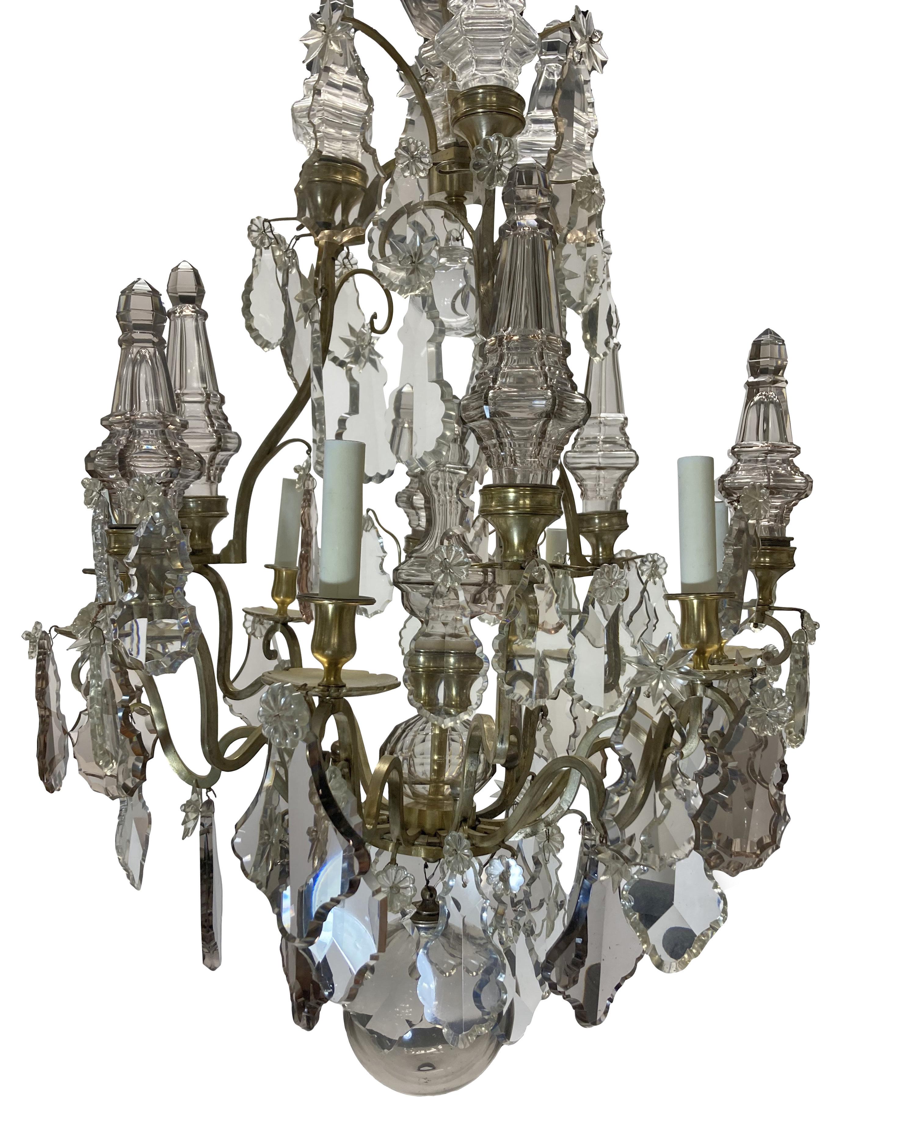 A fine French Louis XV style Baccarat chandelier, in gilt & silvered bronze and hung throughout with crystal in smoked quartz & rose quartz. The spires and ball at the bottom are all over-scale, giving an opulent feel. With six electrified arms.