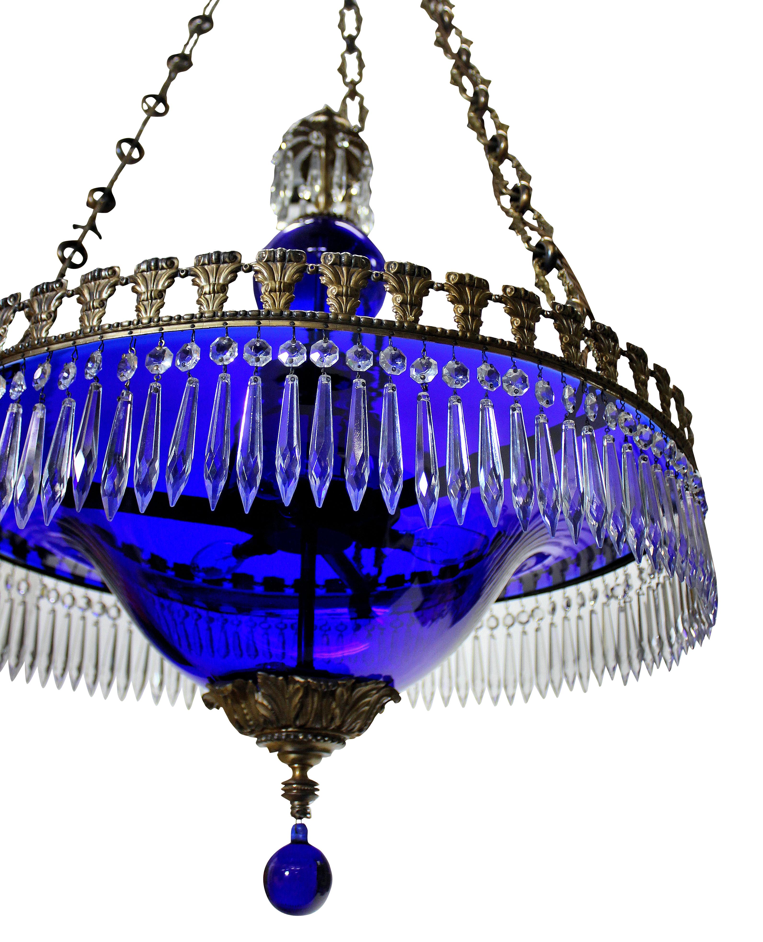 A fine Baltic neoclassical chandelier in blue glass, with gilt bronze frame and hung throughout with cut glass pendants.