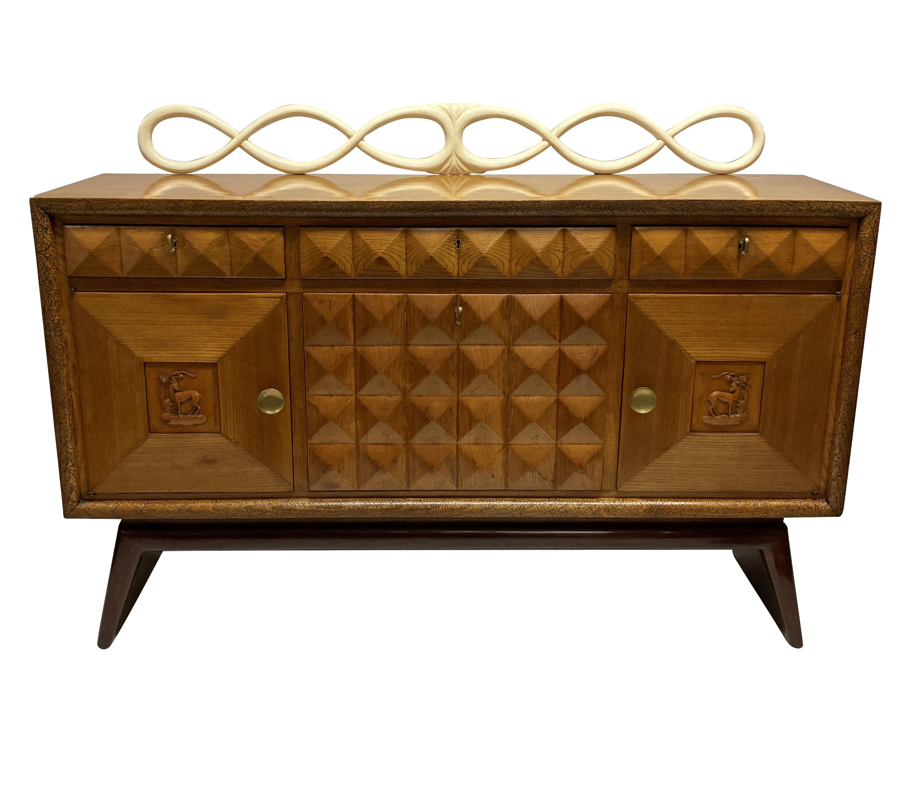 A fine Italian bar credenza by Pier Luigi Colli. In oak, elm and lemon wood, comprising a central fall front bar cabinet, with cupboards and drawers. It has wonderful texture, with a diamond pattern throughout and a faux ivory decorative rail to the